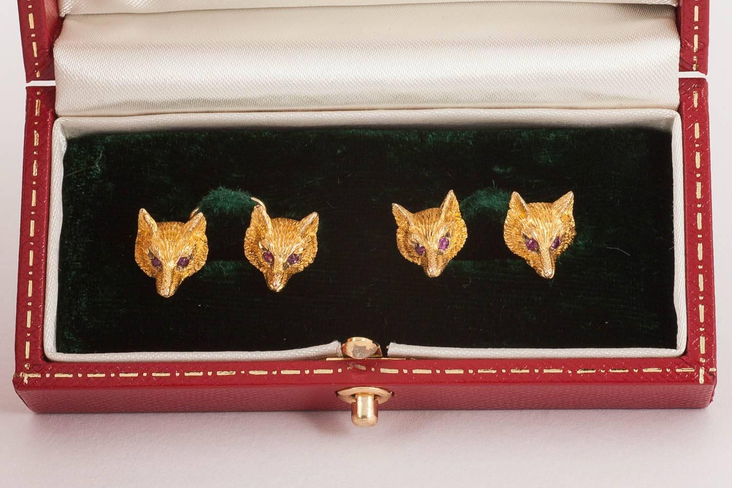 Pair of chased ,9ct gold cufflinks of Fox heads with ruby eyes,10mm across, hallmarked fo birmingham 1931,chain link connections