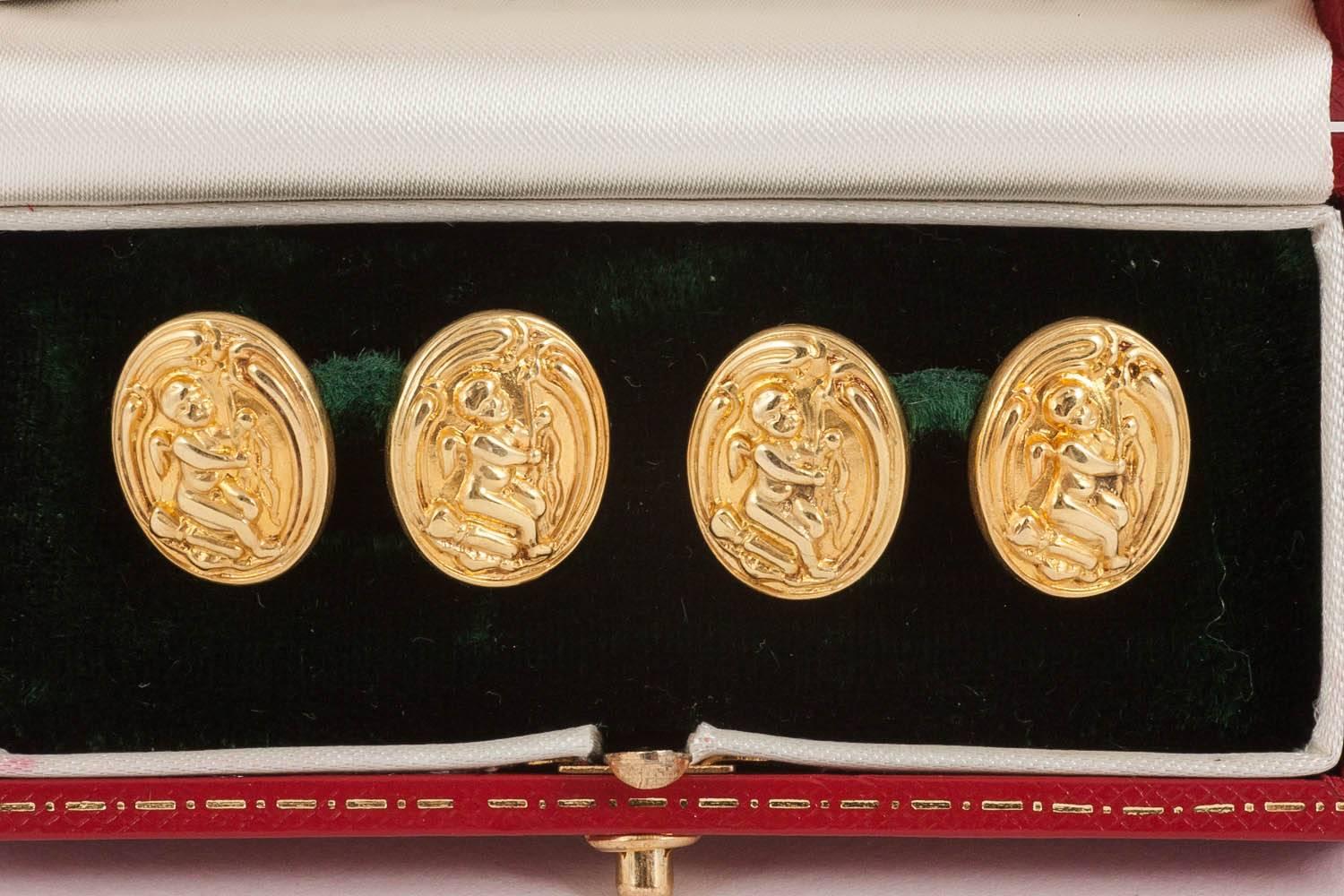 Antique cufflinks in 15 carat yellow gold of winged cherubs playing a musical instrument. Double sided with oval link connection and of good colour and condition. From the Art Nouveau period.
Measures 16mm in height x 13mm in width.
Antique piece