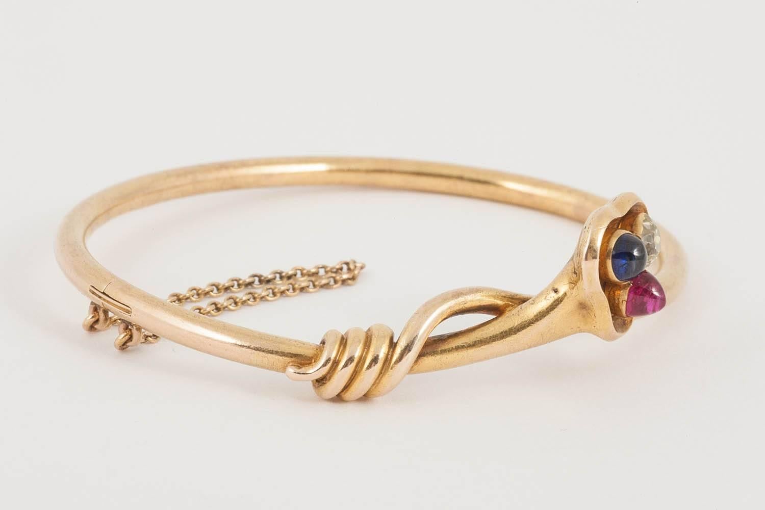 High Victorian Cross-over 18 Carat Gold Bangle with Diamond, Ruby, Sapphire, English circa 1890 For Sale