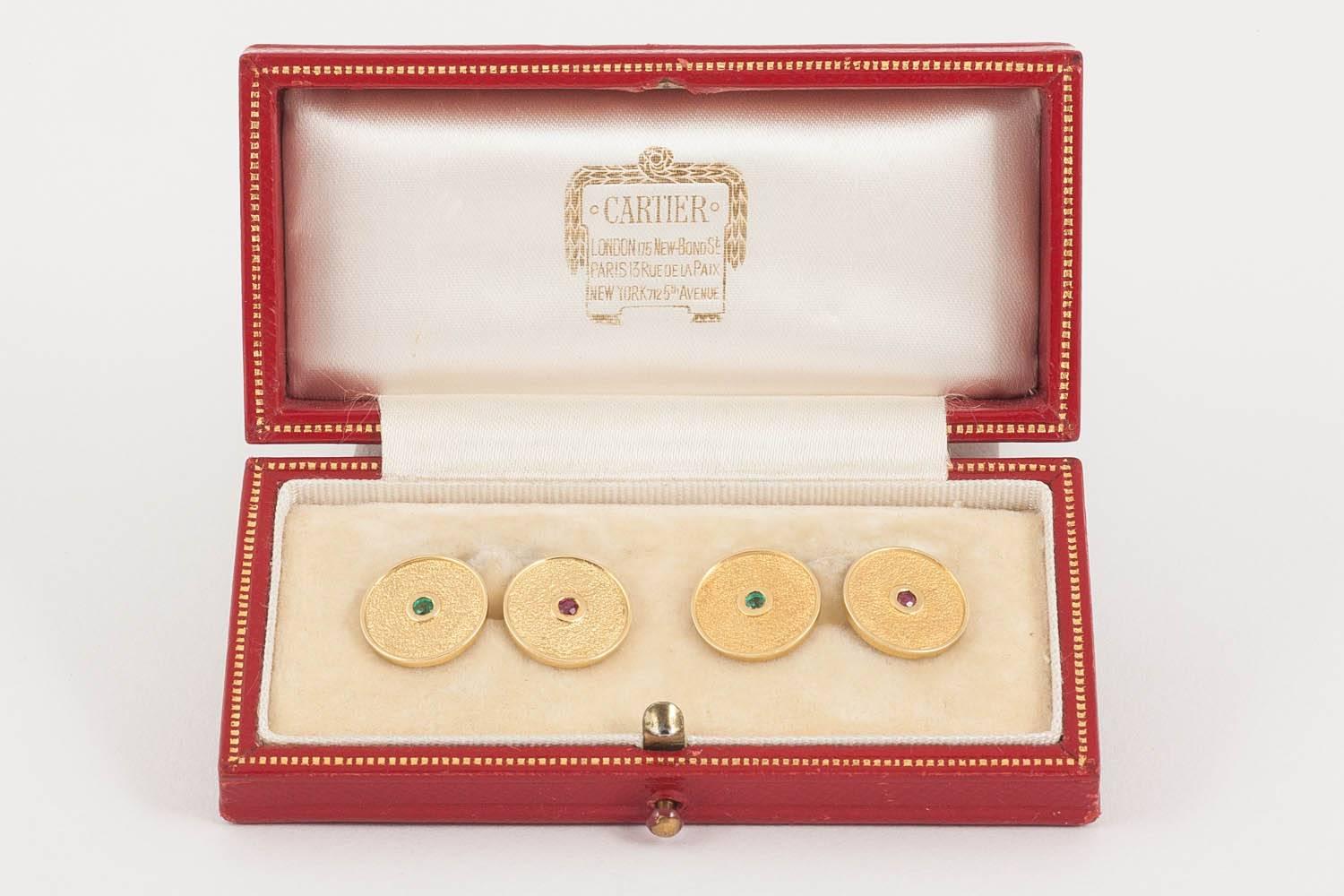 Pair of Cartier 18ct gold cufflinks ,c,1960.french marked,numbered 2418,of circular textured design,set with 2 emeralds and 2 rubies,original Cartier case