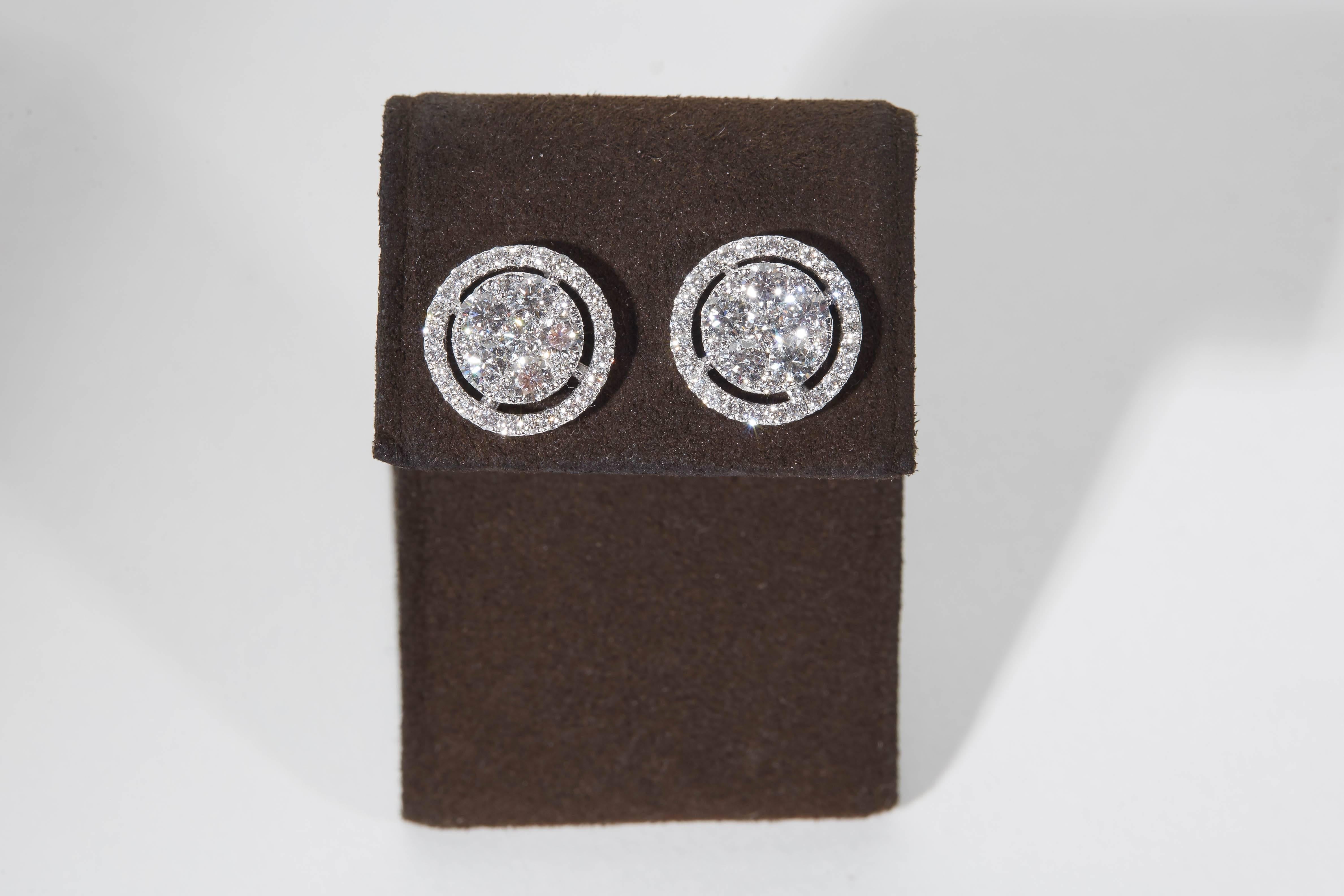 
A stunning pair of diamond stud earrings!

Made up of the highest round brilliant cut diamonds these studs have so much fire and brilliance. 

1.94 carats of colorless white VS diamonds set in 18k white gold.

Approximately half an inch in