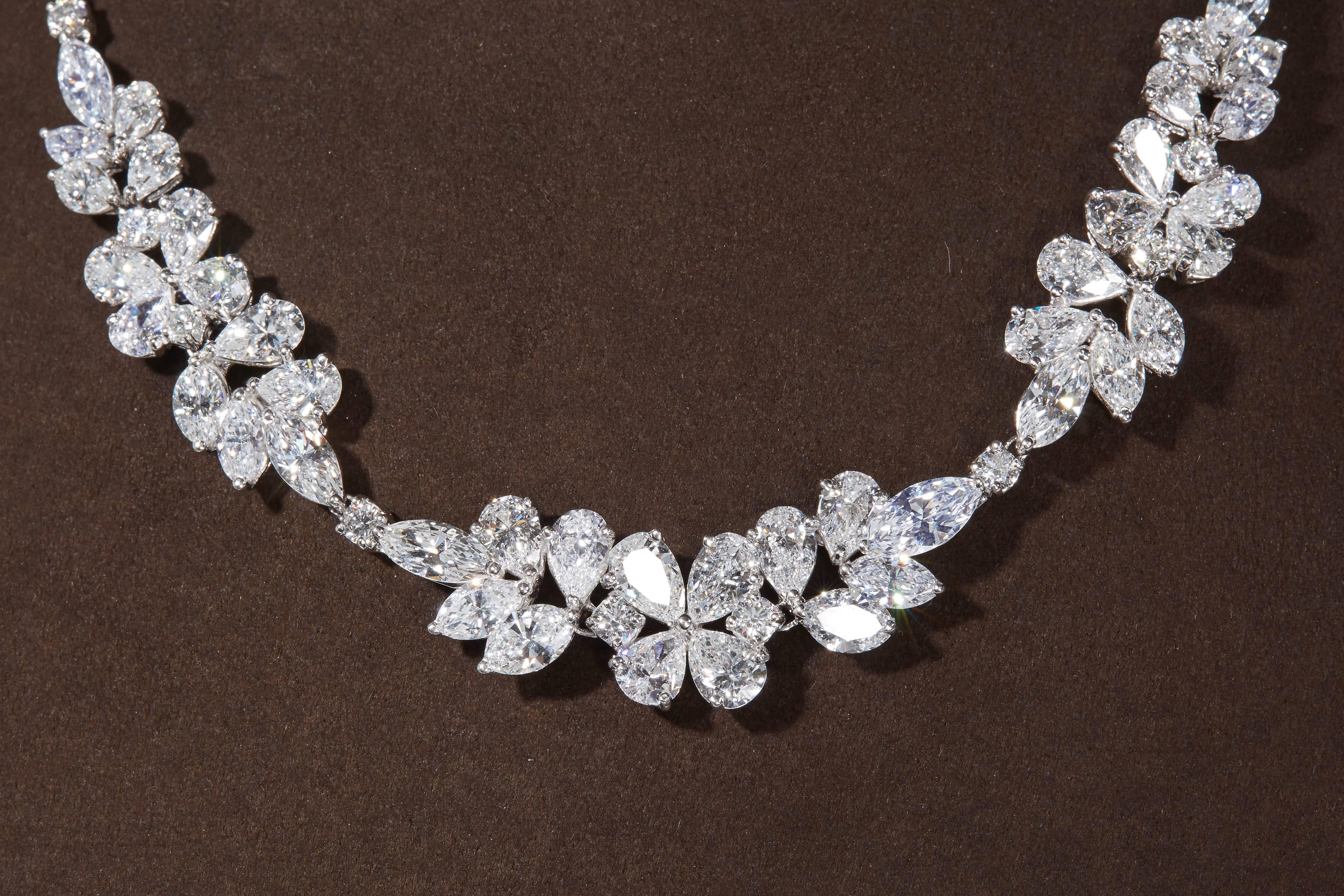 
An important diamond necklace made up of three important clusters.

32.81 carats of large sized white pear, marquise and round brilliant cut diamonds.

Made in New York and set in platinum.

Just under 16 inches in length.
