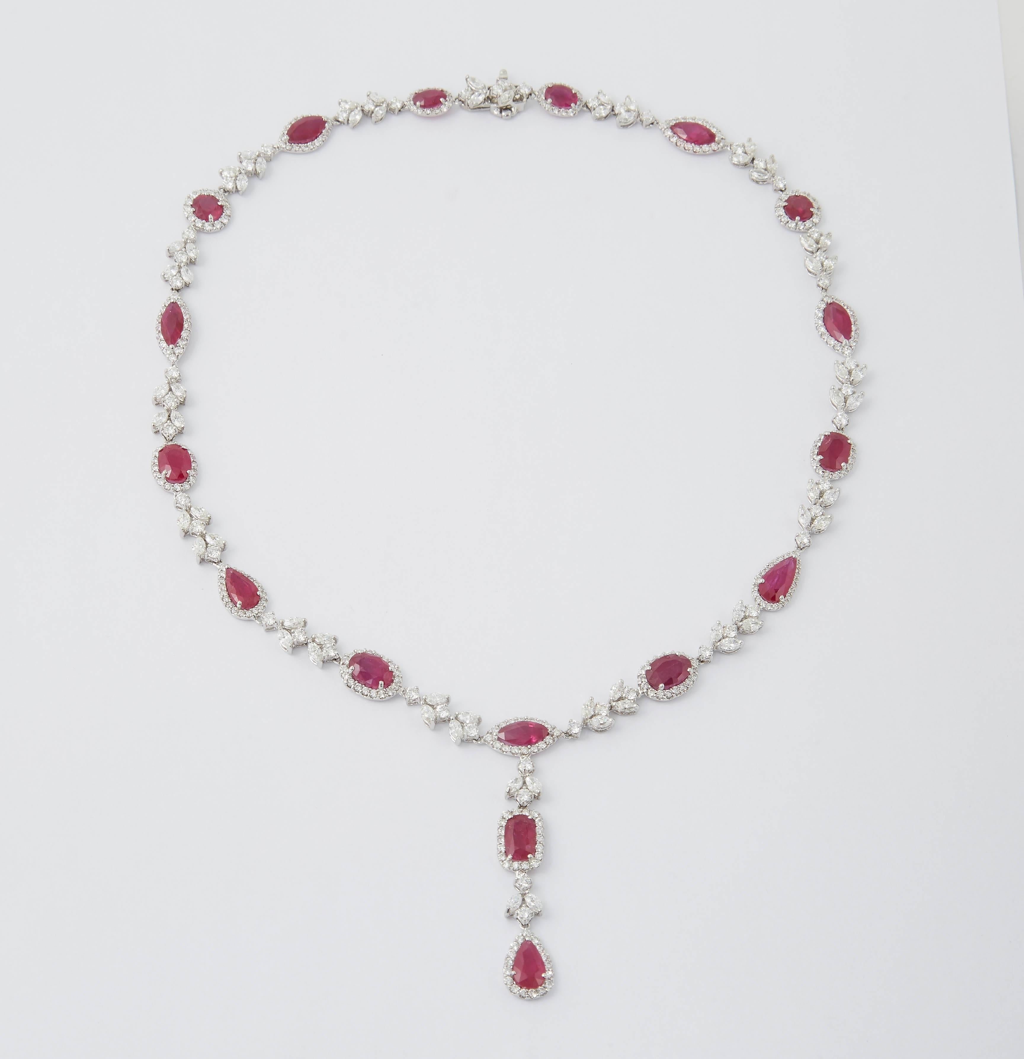 
A beautiful one of a kind piece.

25.27  carats of vivid ruby in multiple shapes. Round, pear, cushion, oval and marquise. 

14.75 carats of white diamonds, marquise and round brilliant shapes.

Approximately 17.5 inches in length with a 2 inch