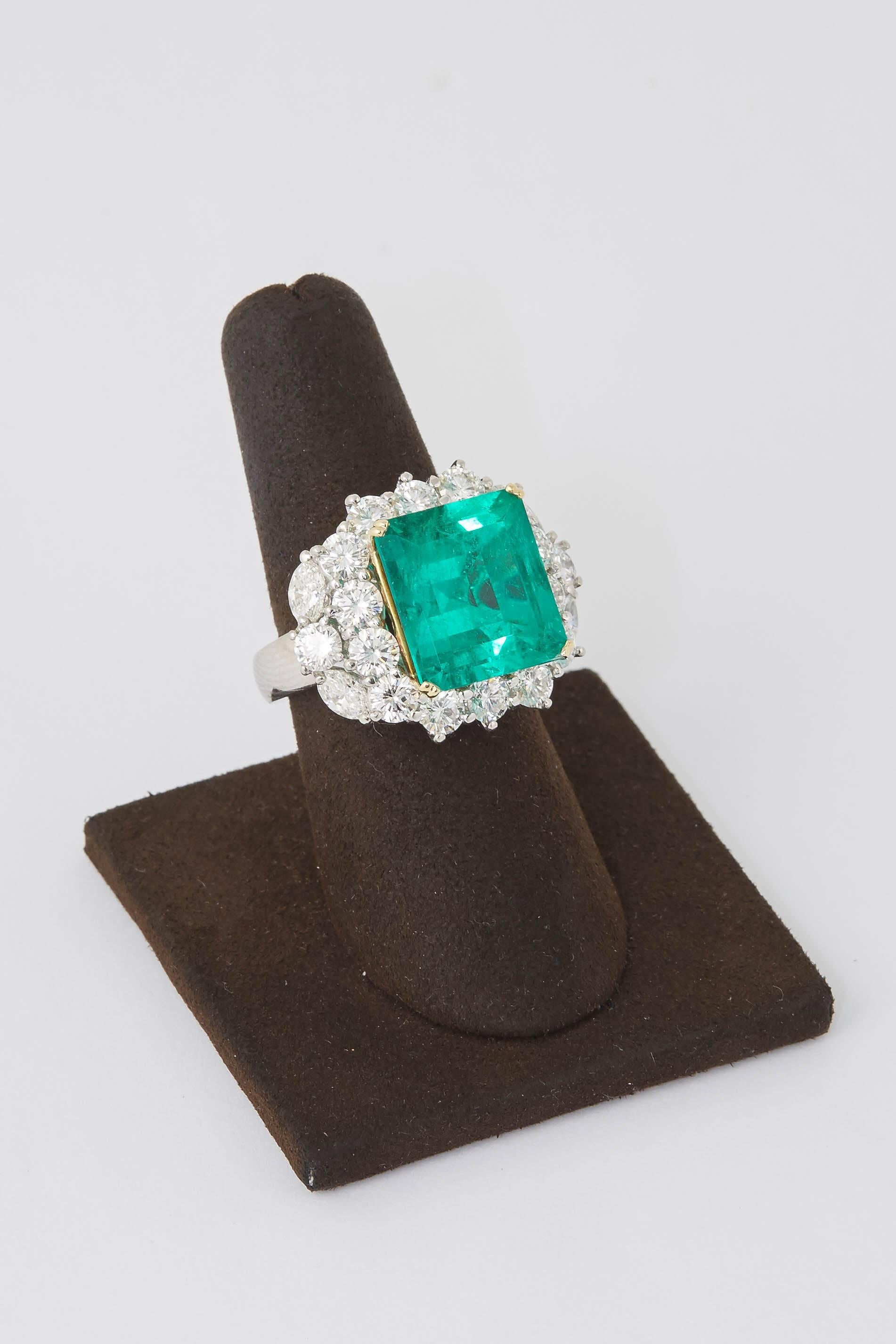 
A DIVINE Emerald!!

11.05 GIA certified Colombian Emerald cut Emerald 

4.62 carats of white round brilliant cut and marquise cut diamonds. 

Platinum and 18k yellow gold. 

size 6.75, this ring can easily be resized. 

21.1 mm x 24.13 mm