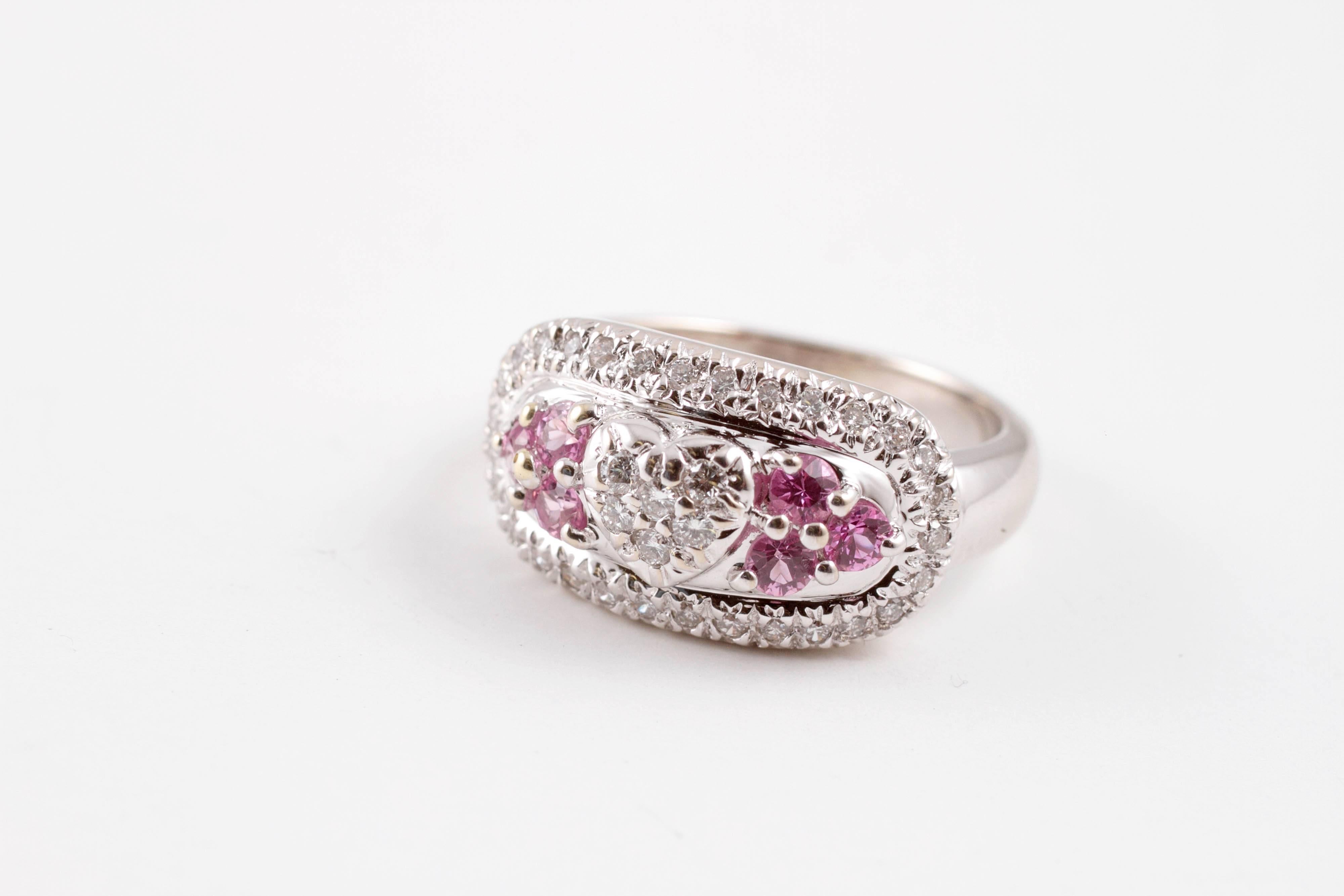 Beautiful pink sapphire and 0.40 carat diamond ring, in 18 karat white gold.  5 1/2