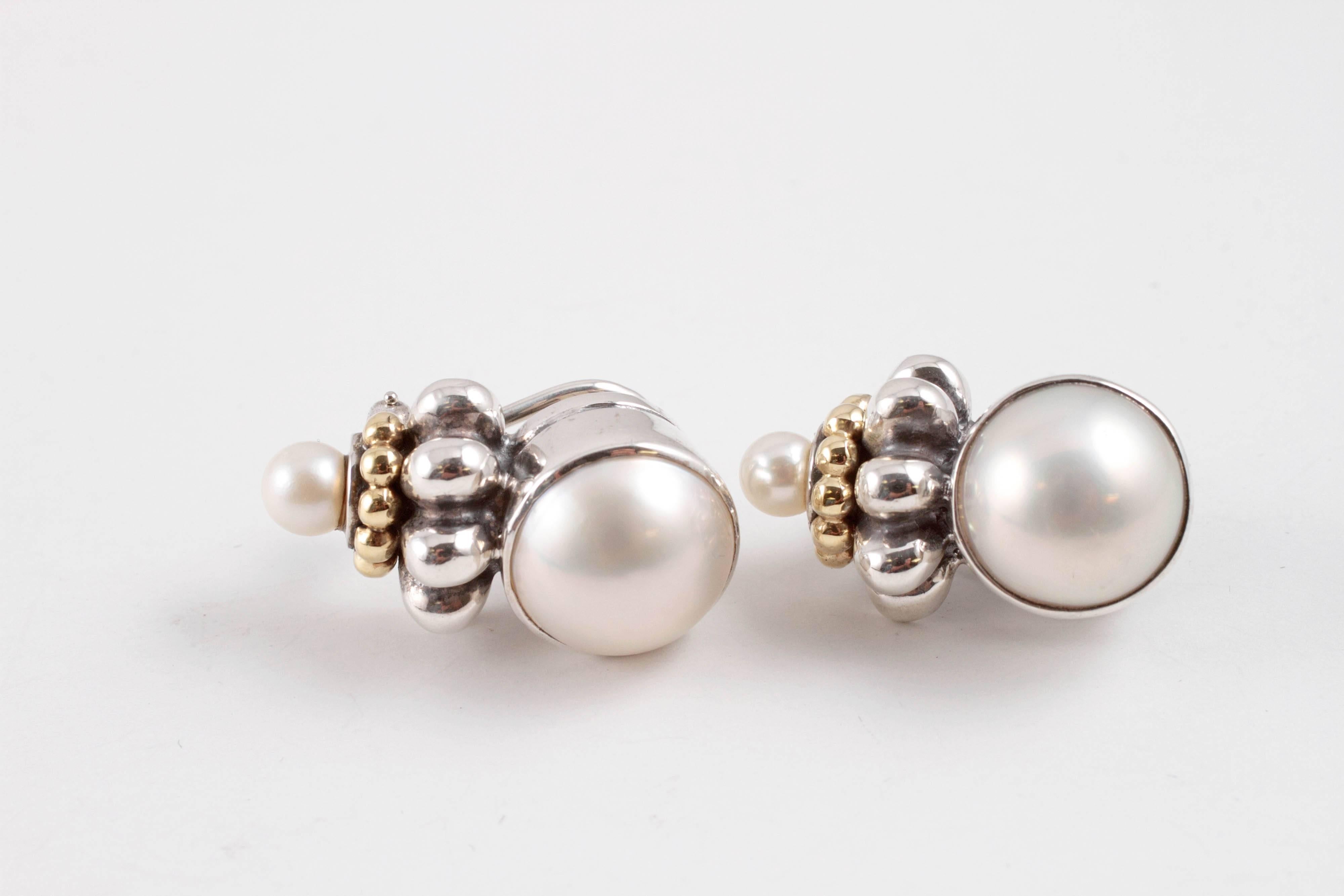 Dress them up or wear them with jeans!  In sterling silver with 18 karat yellow gold accents, pearl earrings with pierced/clip back.