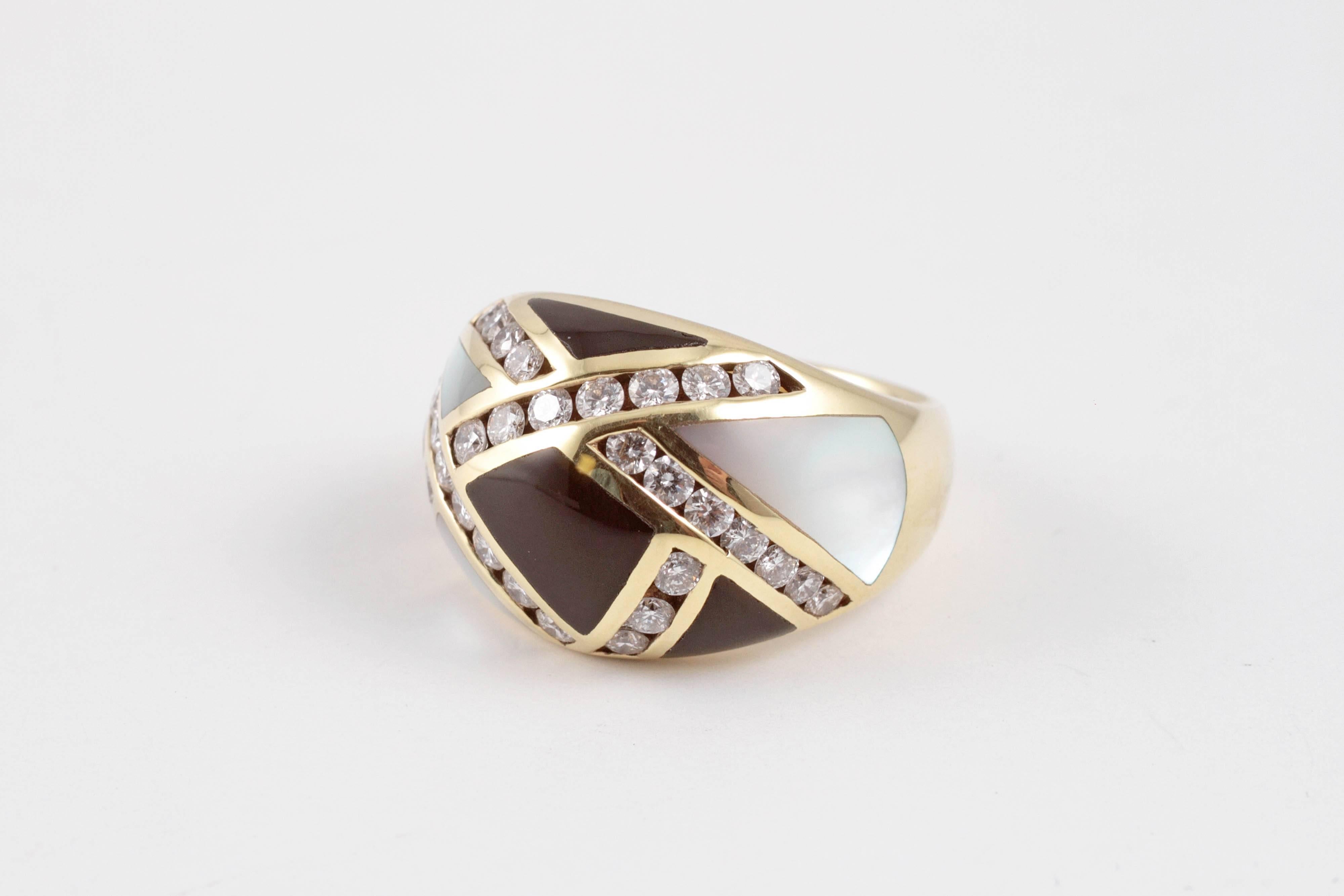 Such a stunner!  In 14 karat yellow gold with 1.00 carat of diamonds, mother-of-pearl and onyx inlays. Size 6 1/2.