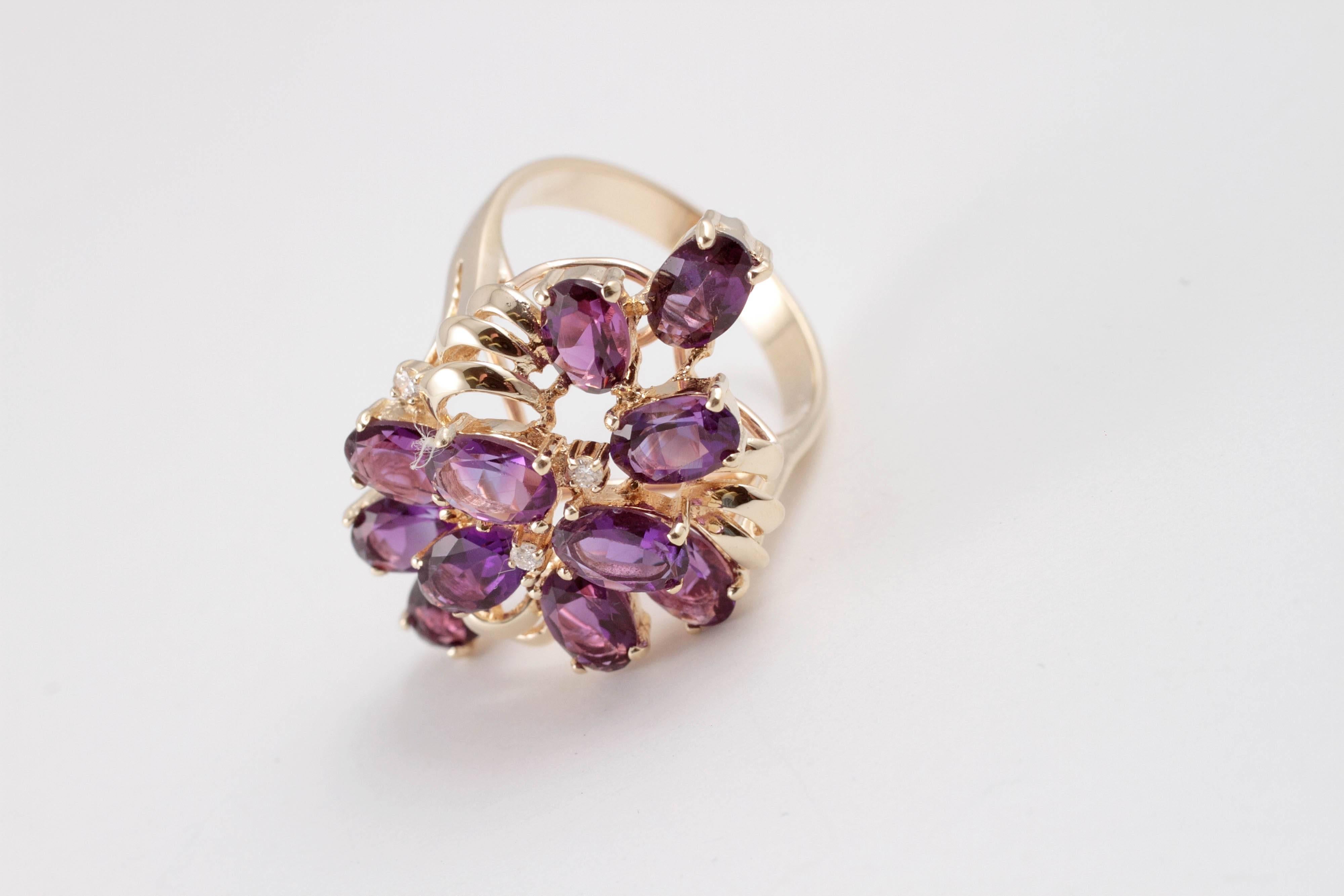 Dazzling amethyst cluster ring sprinkled with diamonds that creates a masterpiece right on your finger.
Ring size 6.5.