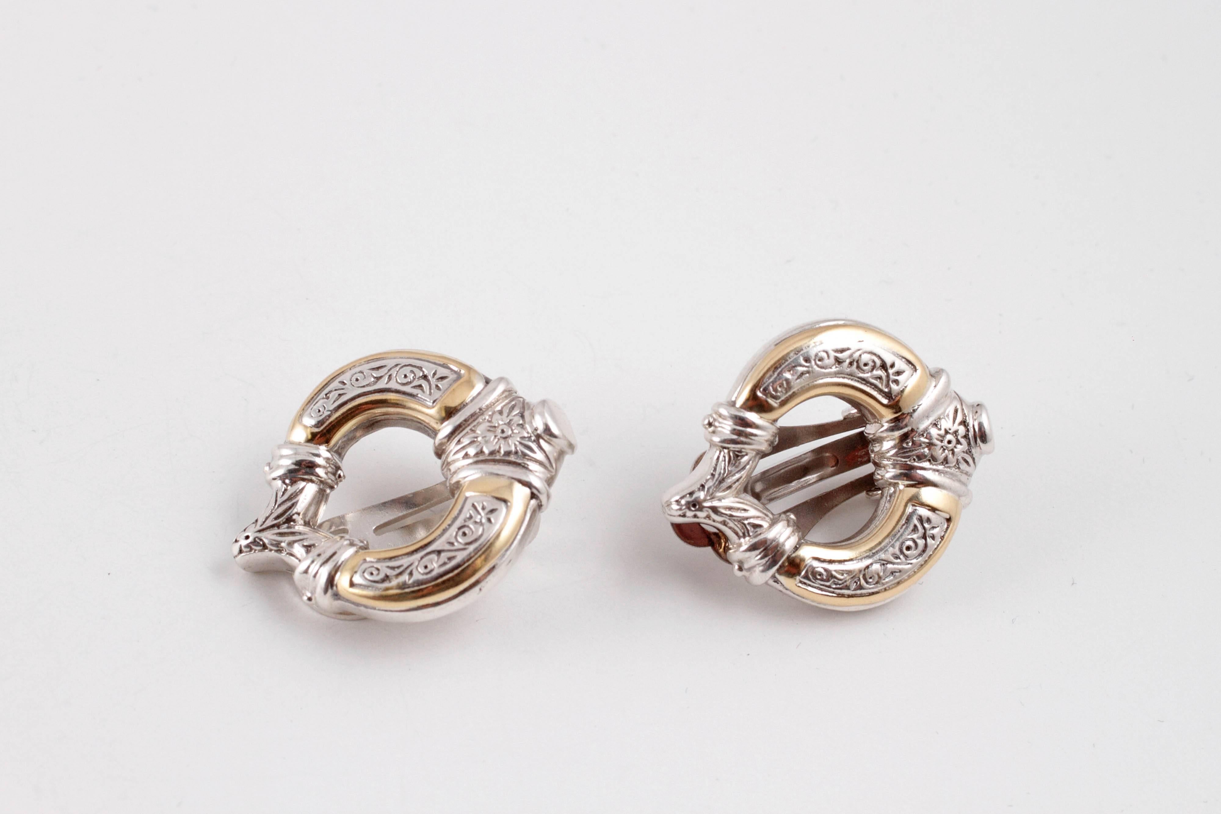 18 karat yellow gold and sterling silver clip on earrings.  Lovely!
