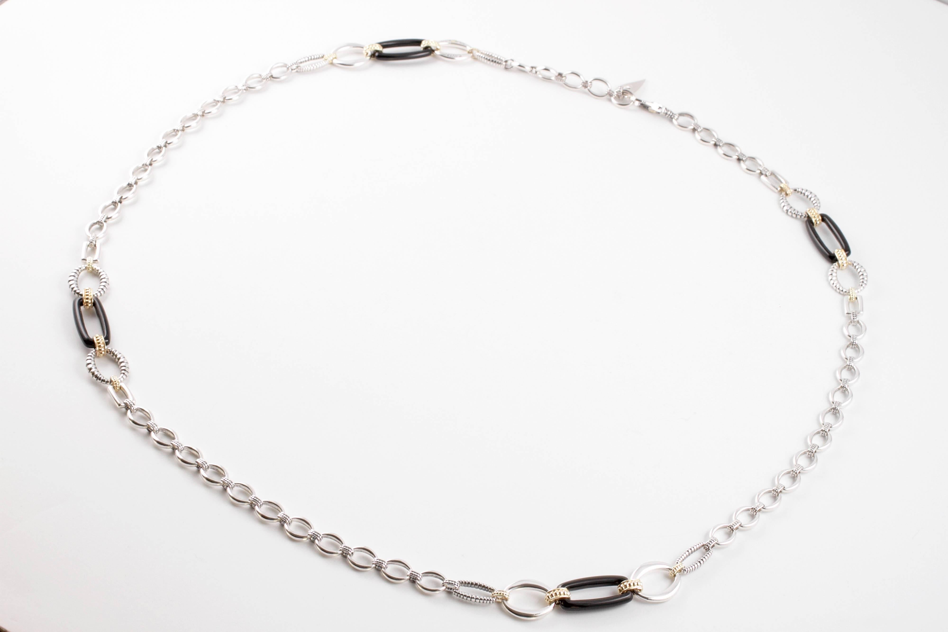 I just love this piece!  It goes with everything and is long enough to wear as is or drape it around your neck twice for a choker!  In sterling silver, with yellow gold accents and black ceramic spacers.