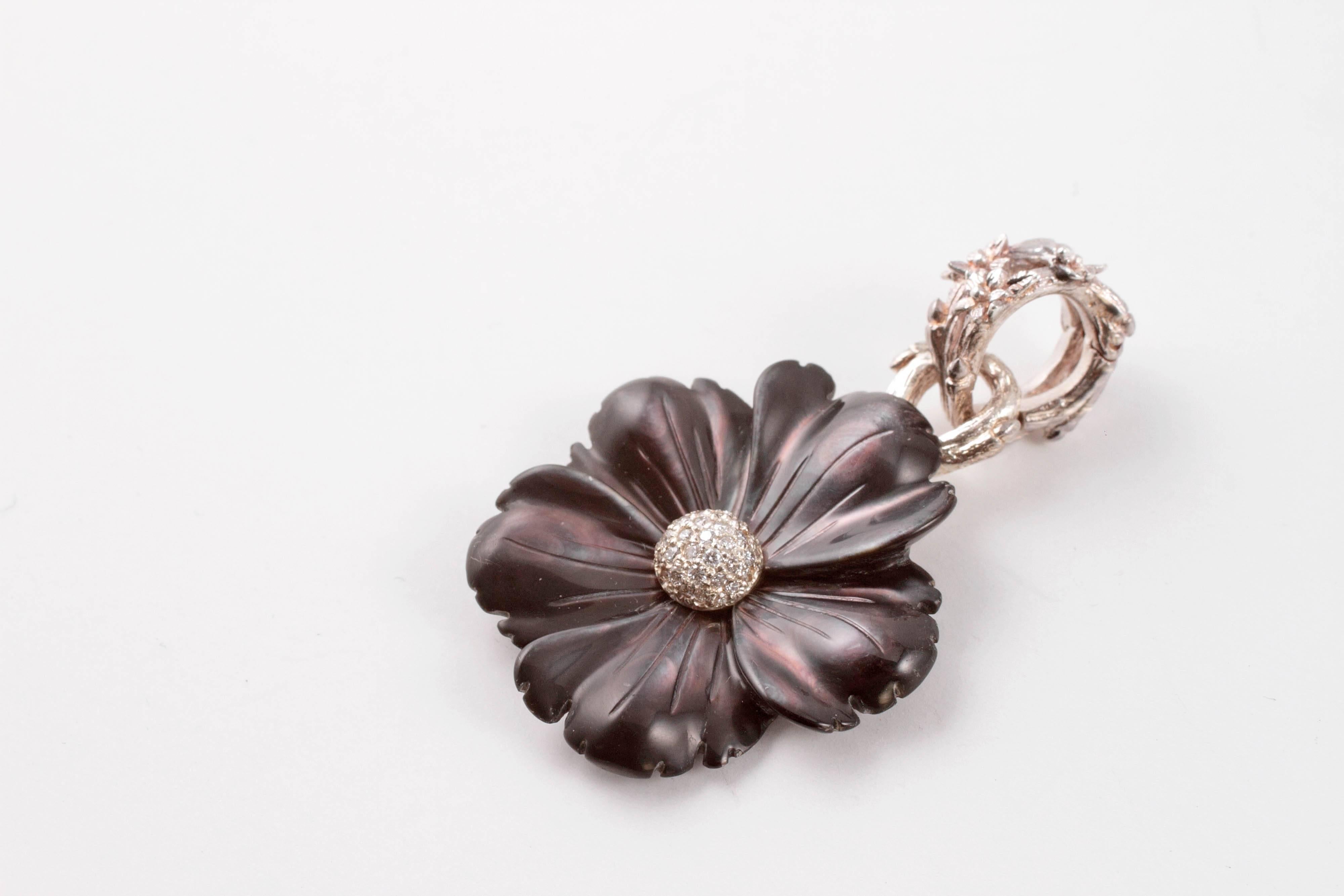 If you are a Dweck follower - or if you have never heard of him - this is for you!  A fun and different carved agate flower form, centered with bead-set diamonds, with a butterfly bail!