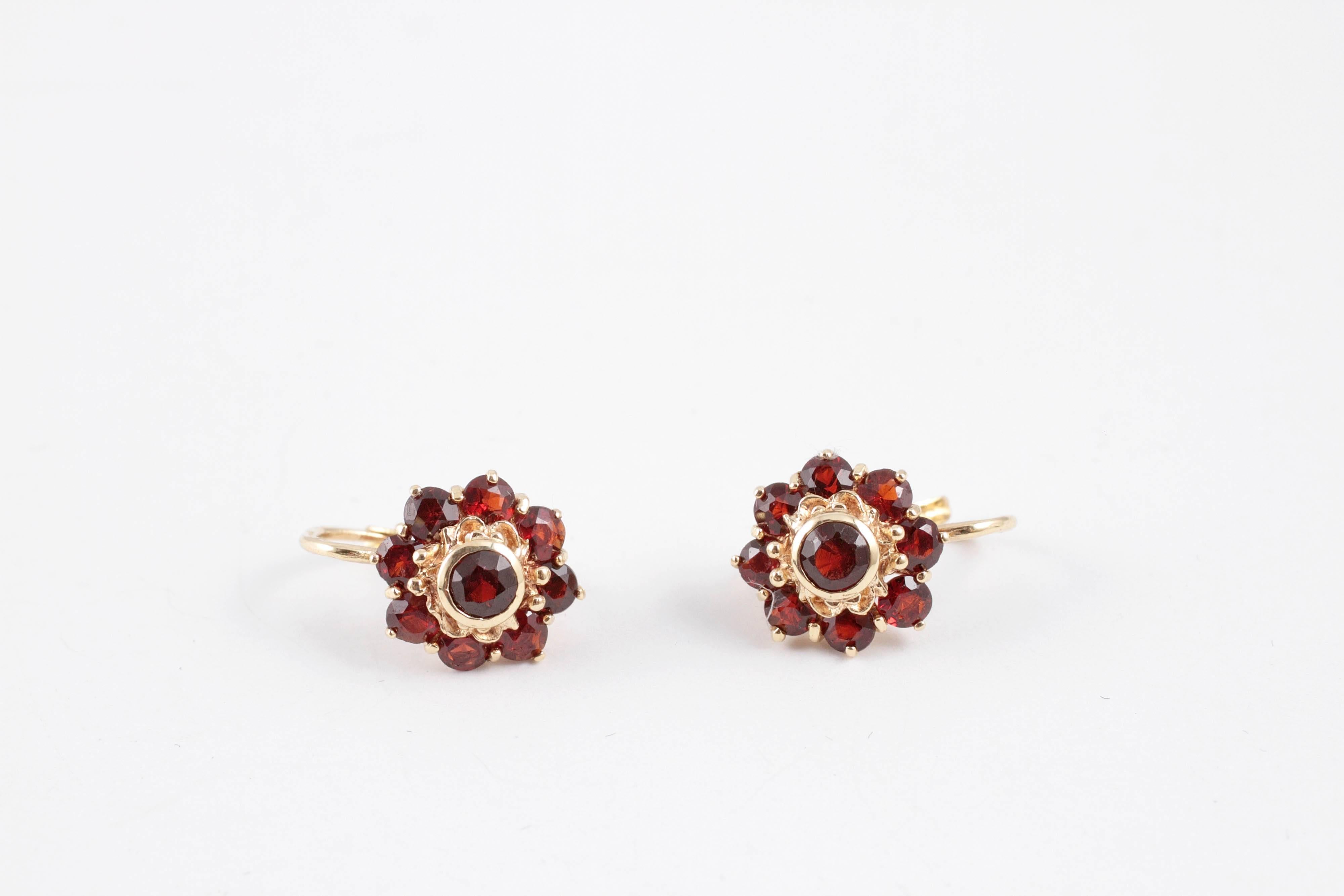 18K yellow gold garnet flower earrings, secured with a lever-back.  
