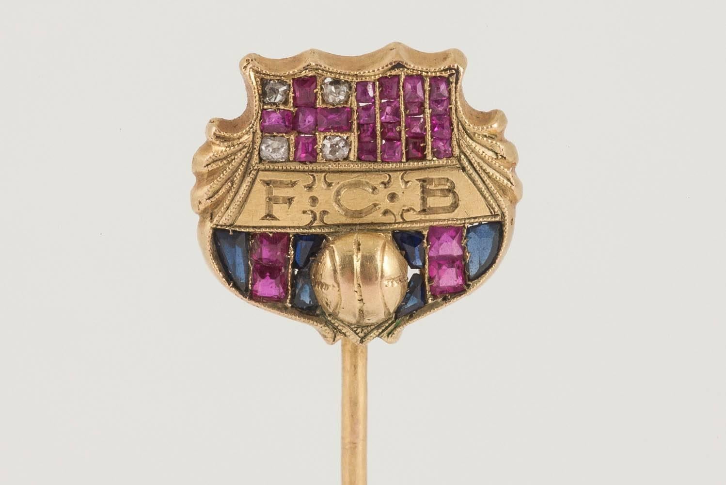 An unusual and finely made 18 karat yellow gold Tie Pin of the badge for Barcelona Football Club. Set with diamonds, square cut Burma rubies and shaped sapphires, French import marks.
Measures 13mm across.
Antique piece (over 100 years old) and in
