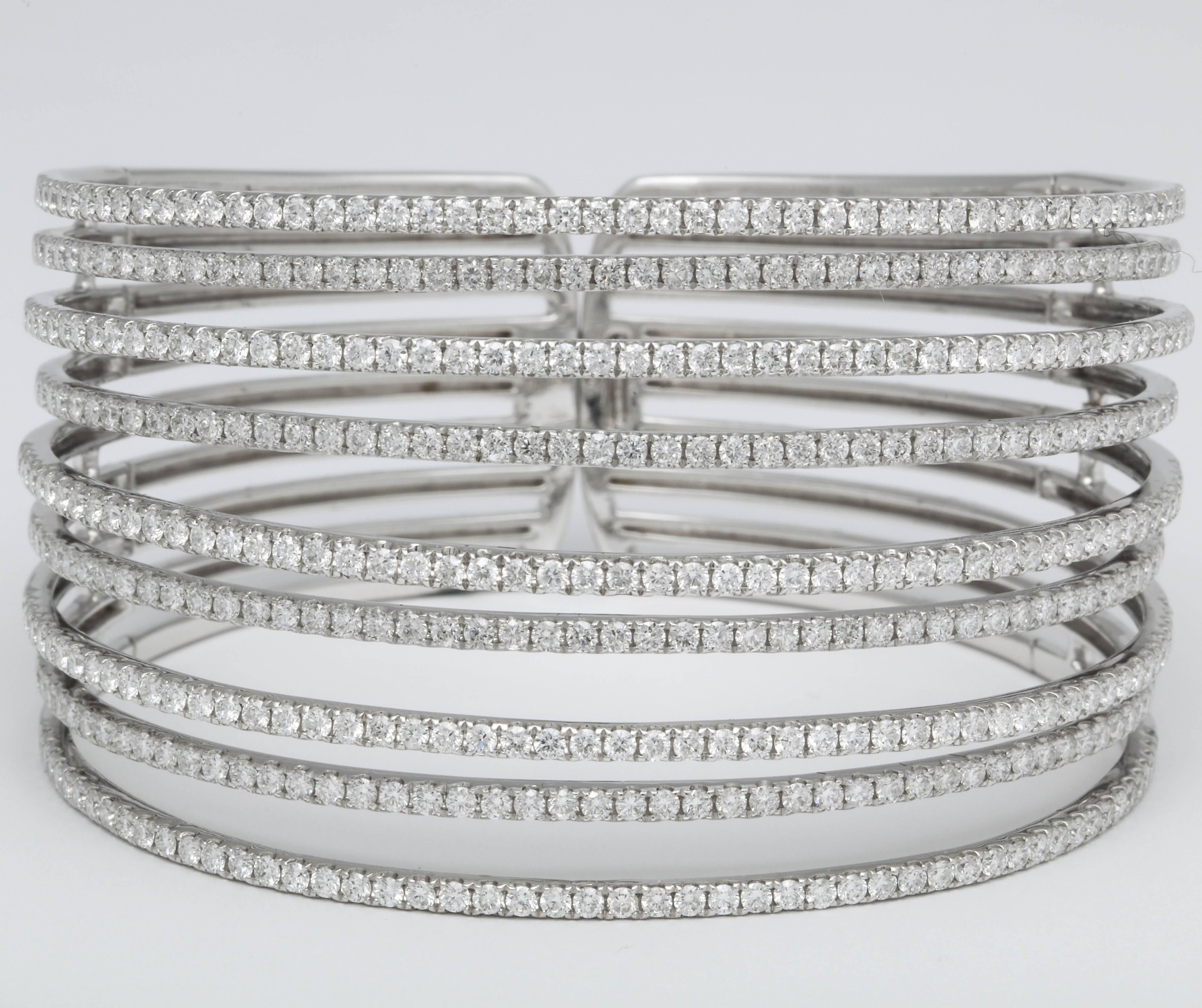 
A beautiful and wearable piece!!

9 lines of white round brilliant cut diamonds set at two different heights -- this bangle was exceptionally designed.

7.75 carats of white round brilliant cut diamonds set in 18k white gold 

Approximately 1.57