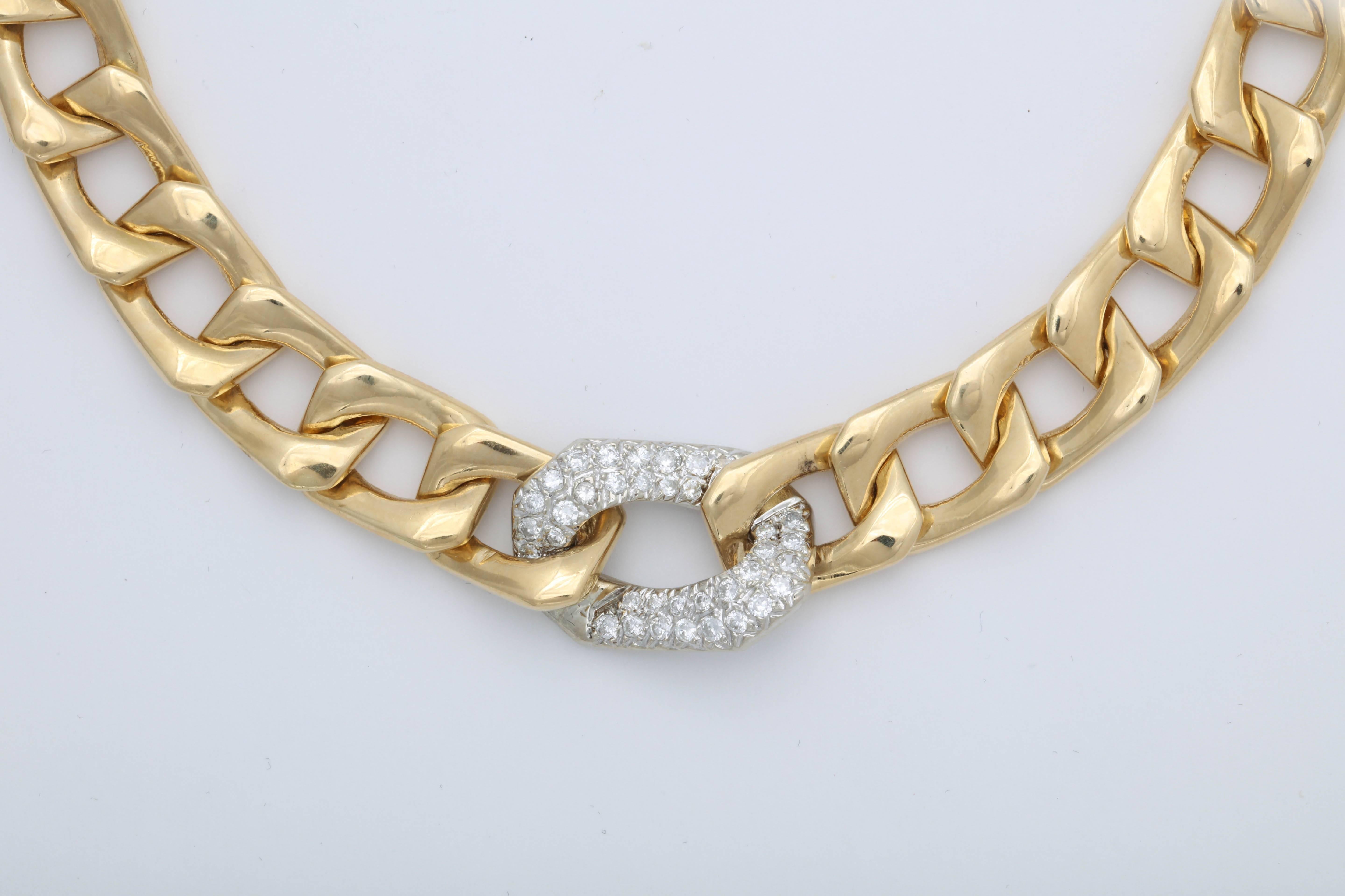 Large open spaced Flat curb chain link with Center Pave Diamond oval Link.  Diamonds clean, white & full cut totalling almost 2 carats.   Can be very dressy or can be worn as a signature piece all the time!