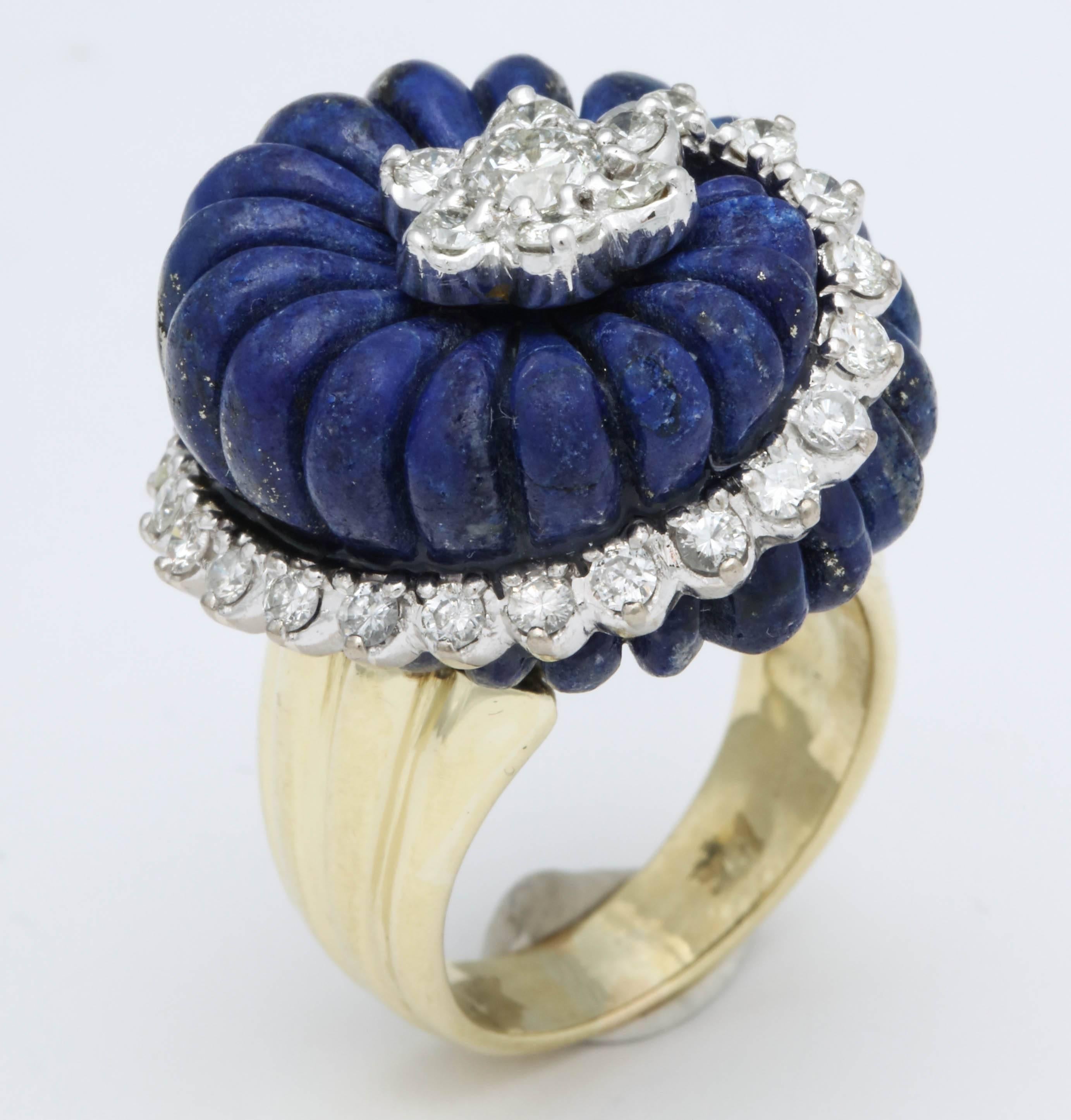 Carved Melon Shaped Lapis Lazuli  Ring set in an 18kt Yellow Gold  fluted shank and bisected by full cut White Diamonds set in 18kt White Gold and ending with a Diamond florette center.  Very high style & Sexy. Highly original and unique.  Size 5