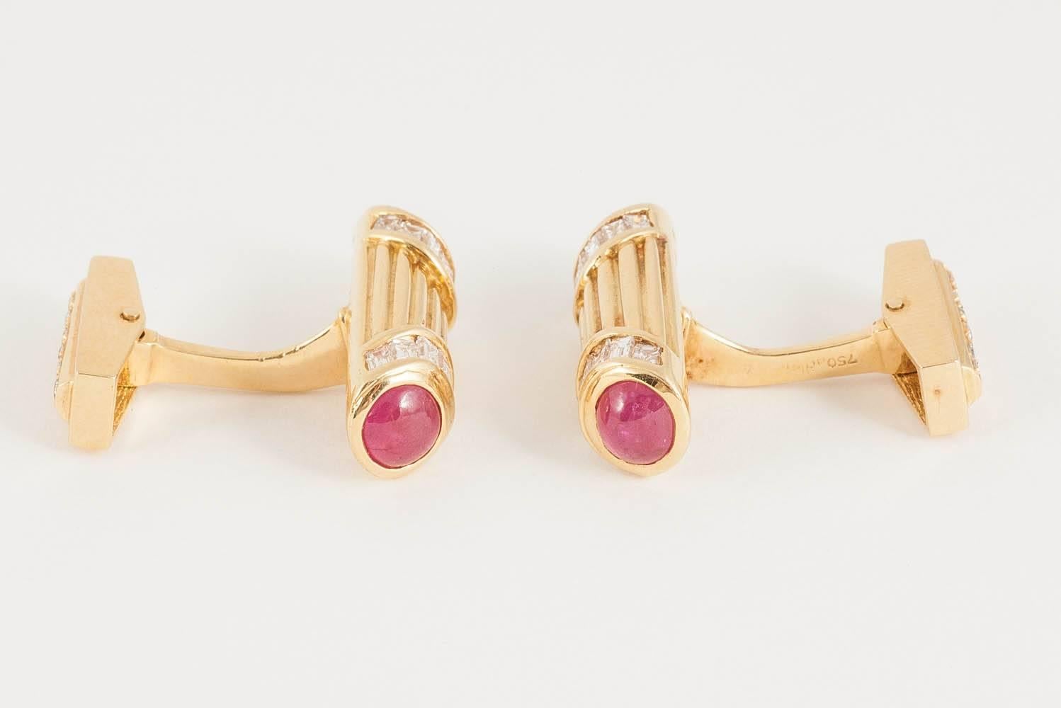 Heavy quality pair of 18ct yellow gold cufflinks,one end set with two,cabochon cut rubies and tapered baguette cut diamonds,the other swivelled terminal set with small diamonds.signed Adler,who traded from a shop in London’s west end.c 1970