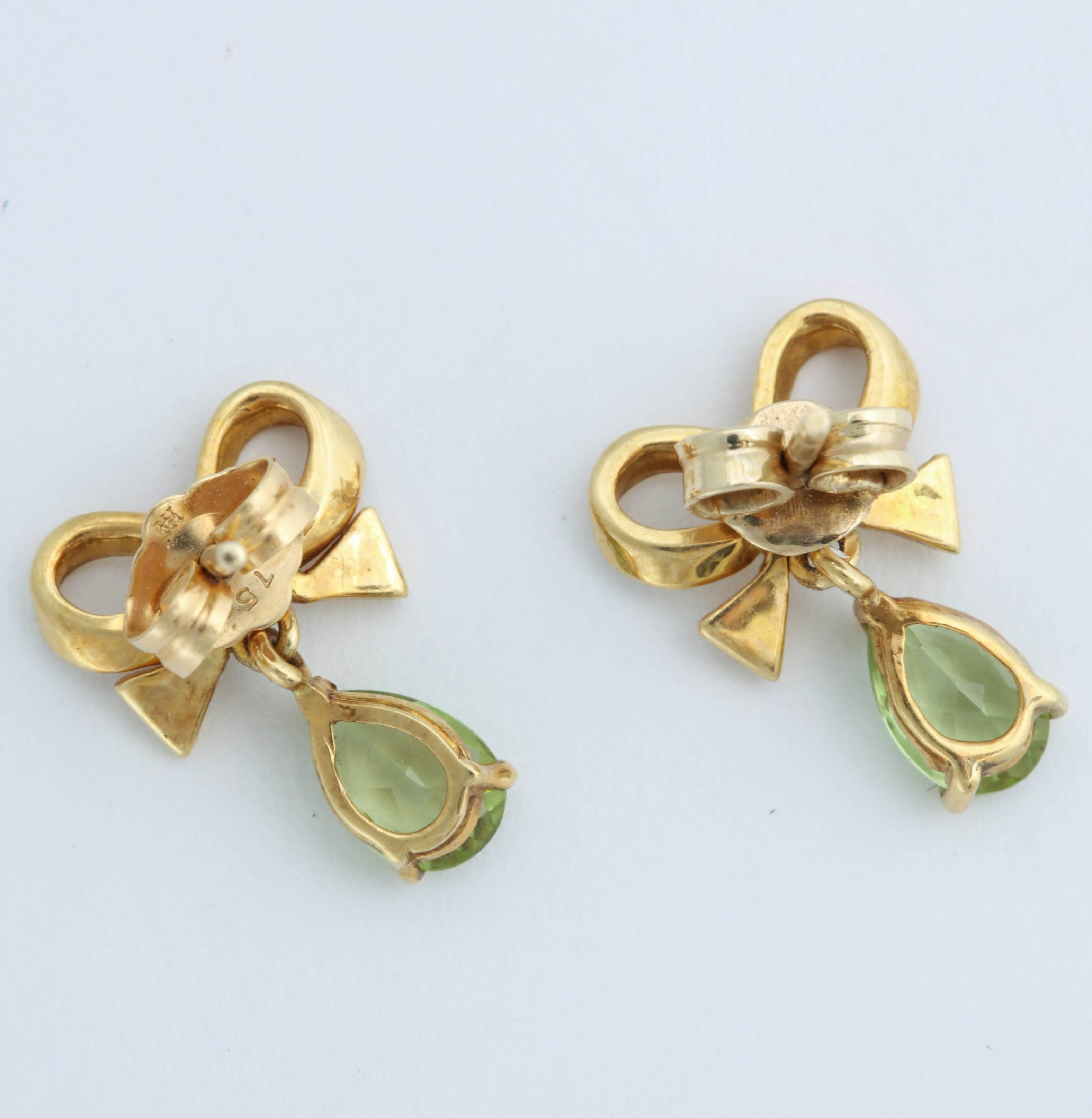 Contemporary Bow Earrings with Pear Shaped Peridot For Sale