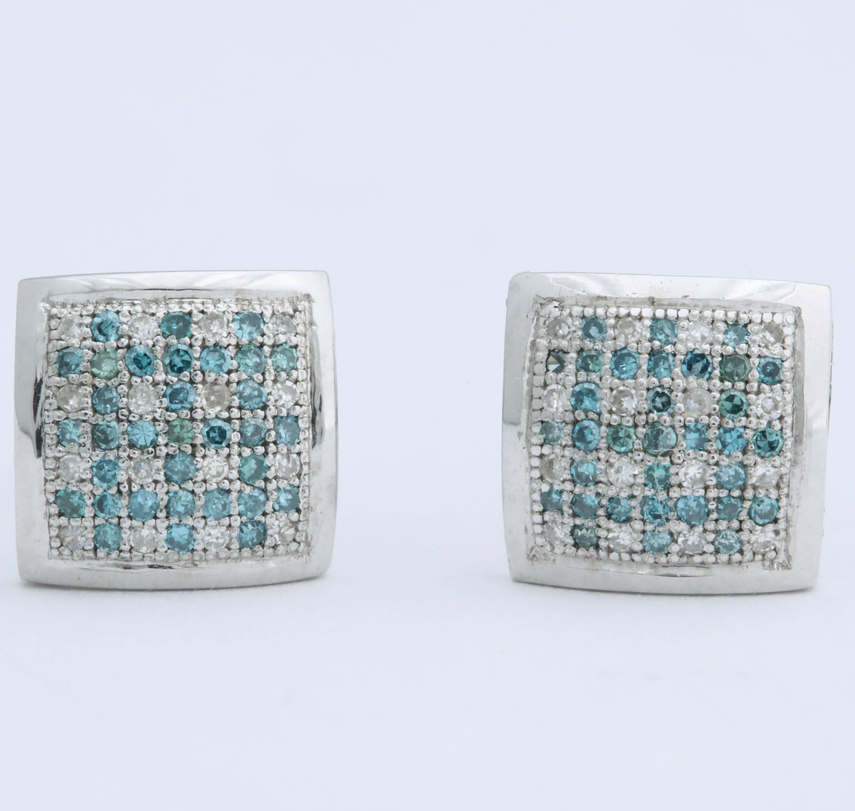 These aqua blue and white diamond earrings are set in 14 kt white gold. The diamonds are set in a checker board pattern alternating aqua and white diamonds. Total carat weight is .80 cts and are 5/8 in. square. They have a screw on post for extra