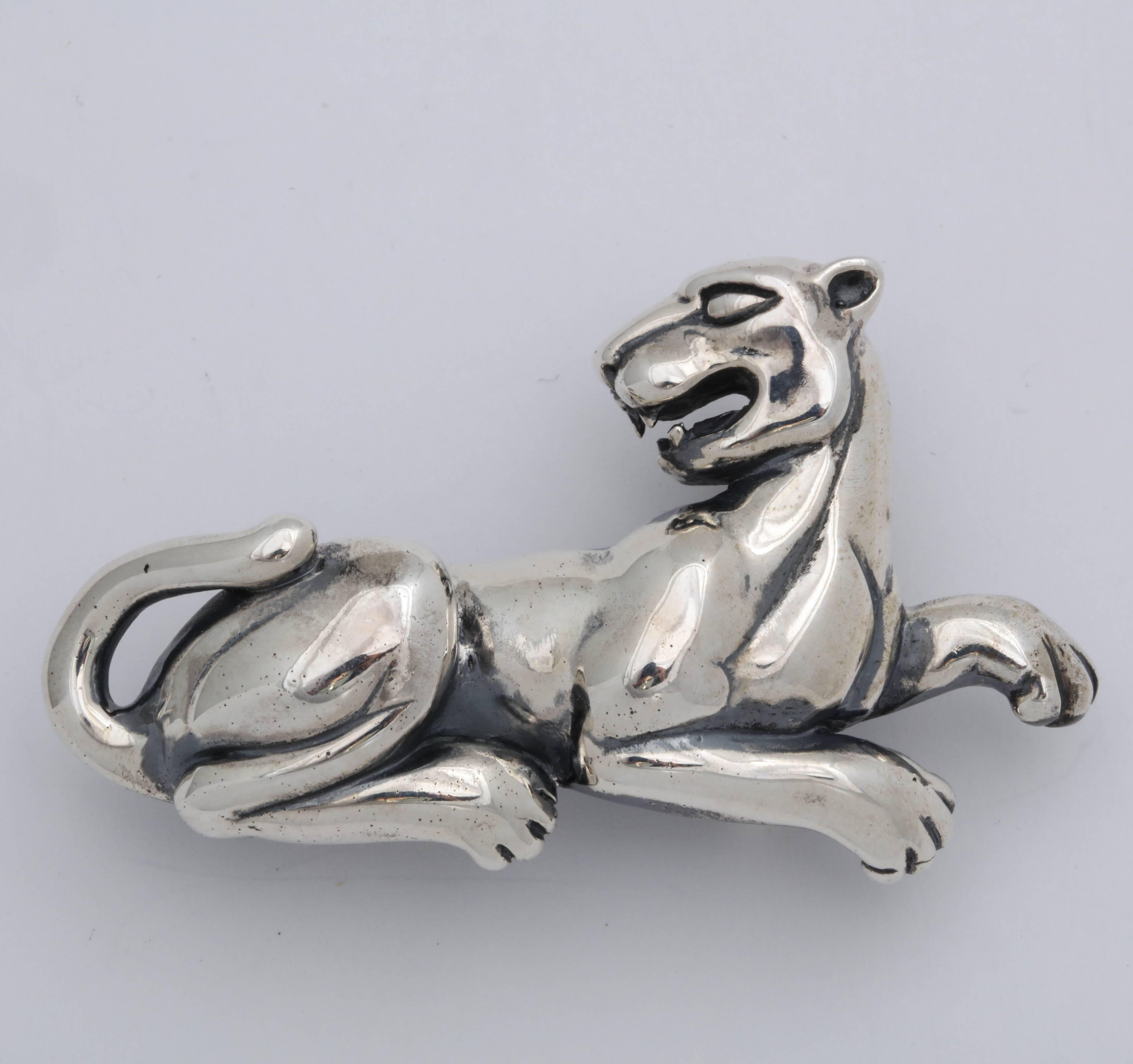 The stunning panther belt buckle fits a 1 in. to 1 1/4 in. wide belt. It has a hook and ball closure. The silver is polished and oxidized to give it depth and a vintage look. The panther is 2 1/4 in long and 1 3/5 in. high.