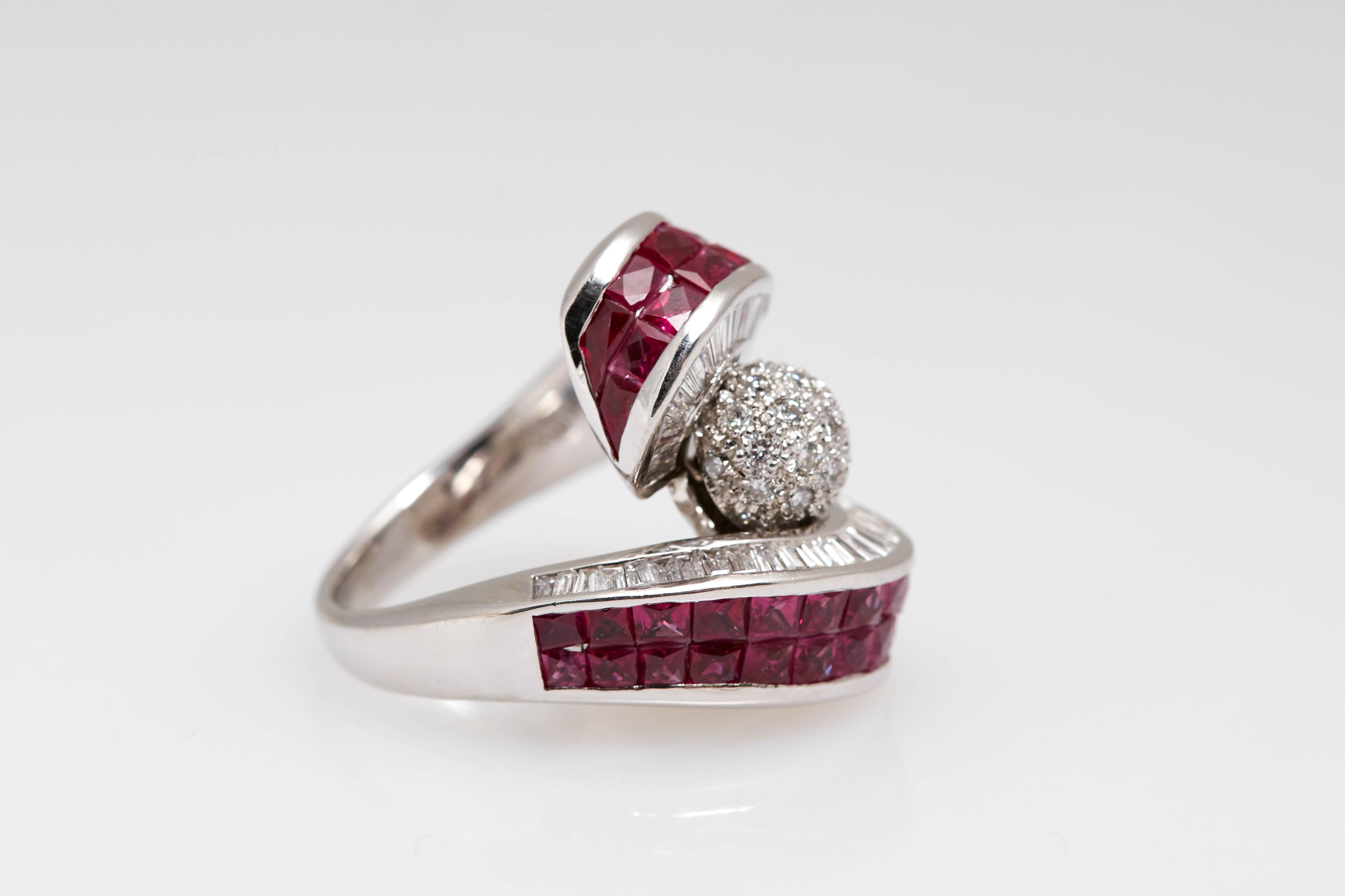 Ring in 18kt white gold with Invisible set rubies (4.8cts) and diamonds (2.7cts). Made in the United States, circa 1980