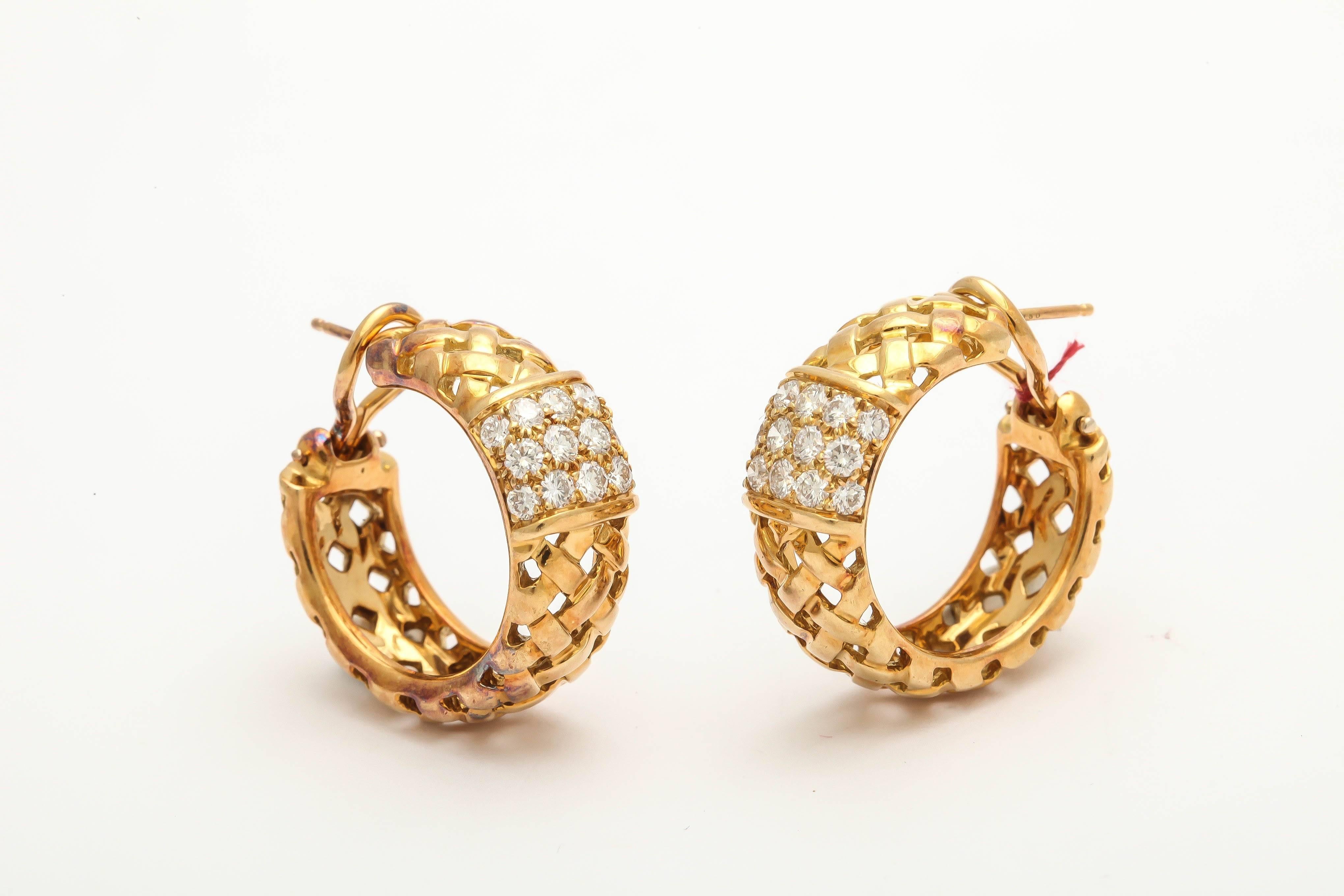 18kt high polish gold earrings comprising of a texturized basket- weave craftsmanship and centering numerous high quality full cut diamonds f-g color VVs Quality weighing approximately 1.25cts total weight. These Classically Designed Earrings Are