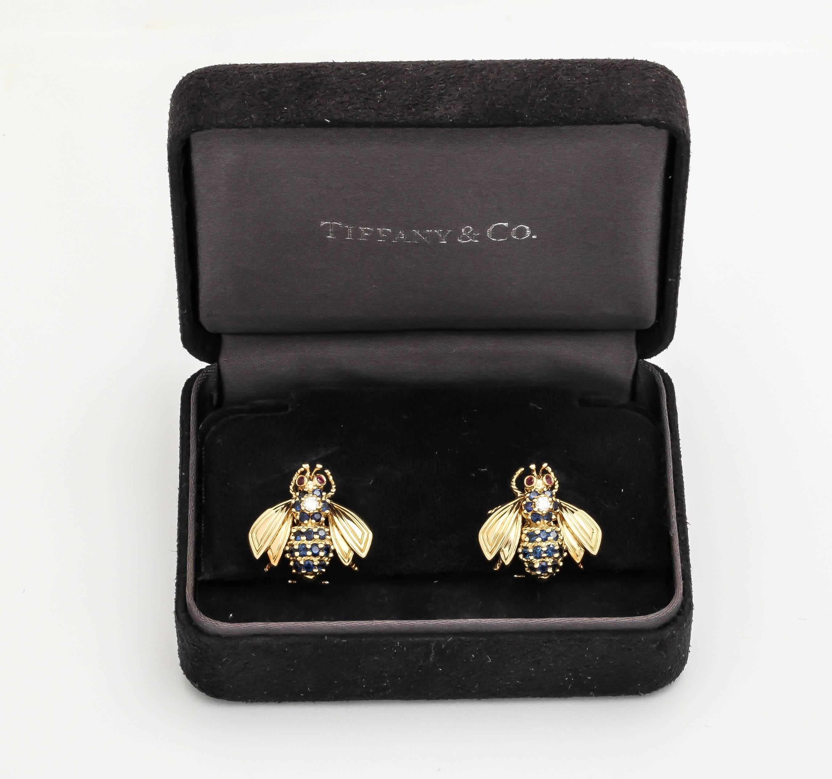 18kt yellow gold figural bee earrings comprising of numerous very high quality sapphires & Very High Quality Diamonds NOTE: Each Diamond Weighing Approximately .15pts Each and further beautifully engraved and texturized Wings And 2 rubies In the