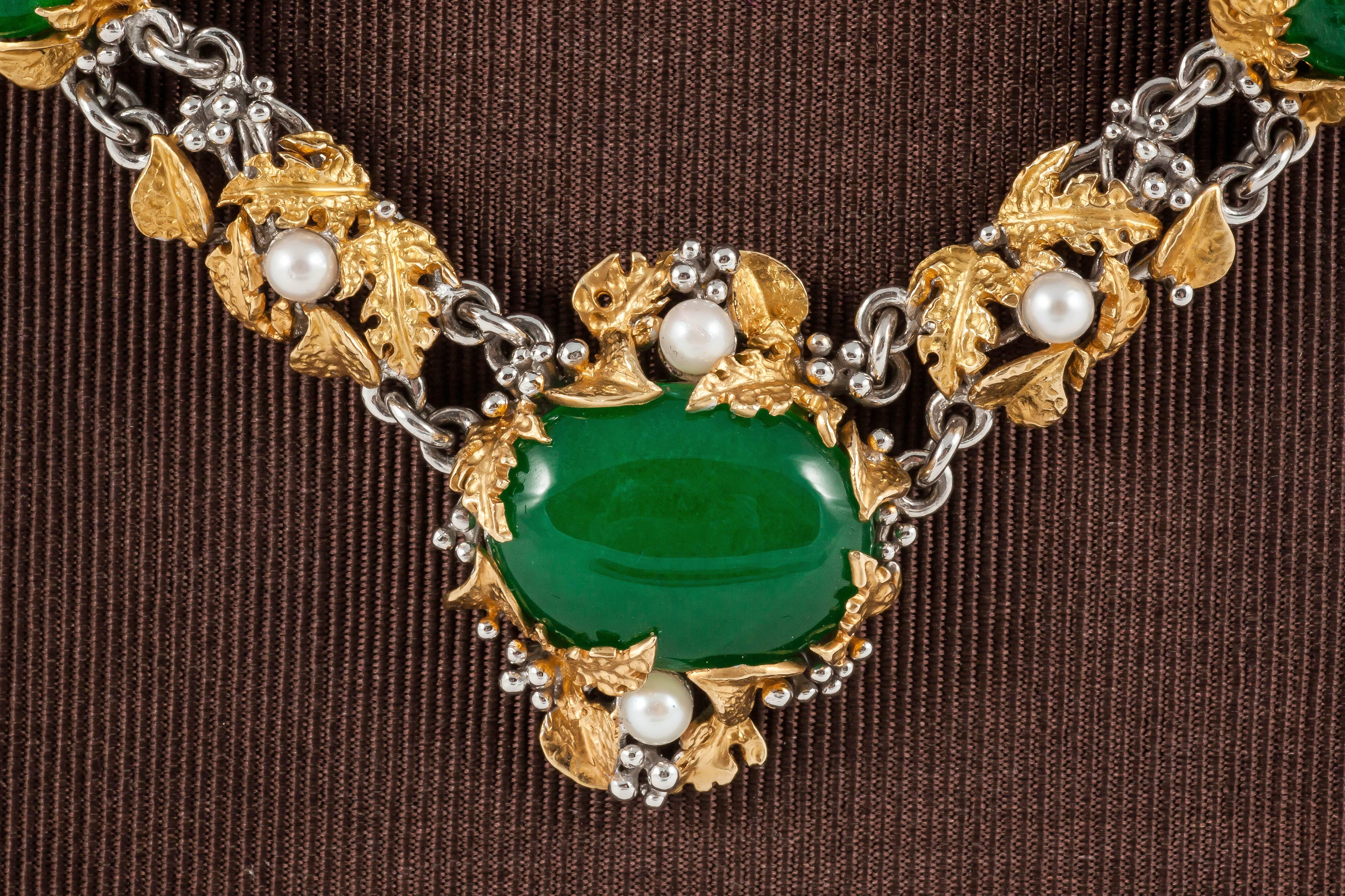 Green Jade surrounded with carved Gold leaves and Pearls Necklace and Studs

Necklace - £16,000
18K Yellow Gold - 108.5gms
Pearl  - 13 pieces 
Jade - 11 pieces

Middle pendant 3cm x 2.5cm 

Earring - £4,700 
18K Yellow Gold - 14.1gms
Jade
