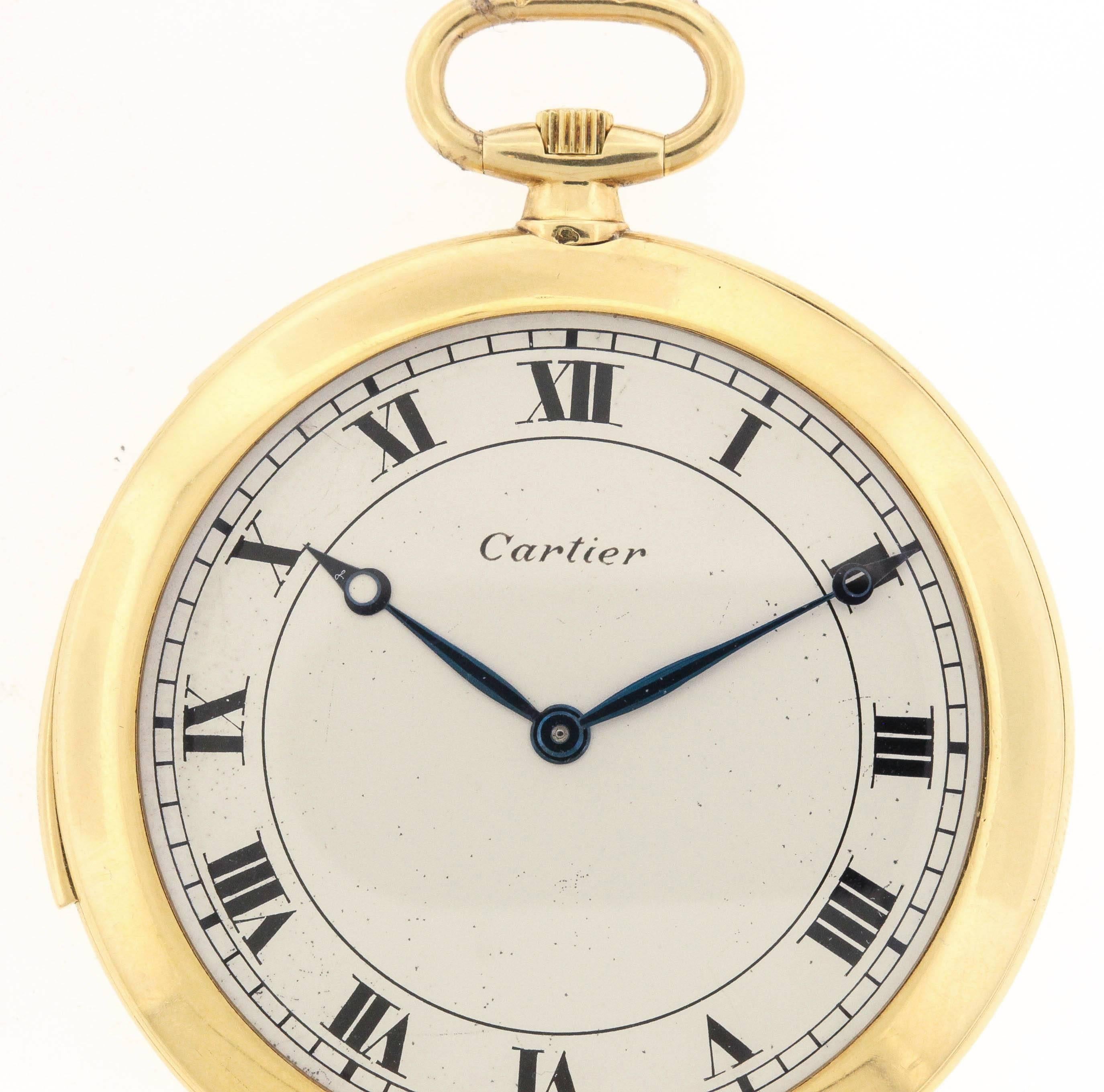 Rare Art Deco open face Cartier, very thin and elegant, minute-repeating, 18K yellow gold dress pocket watch.  The 48.5 mm case has a polished knife edge,  the interior of the back cover with engraved presentation inscription dated 1927.  The matte