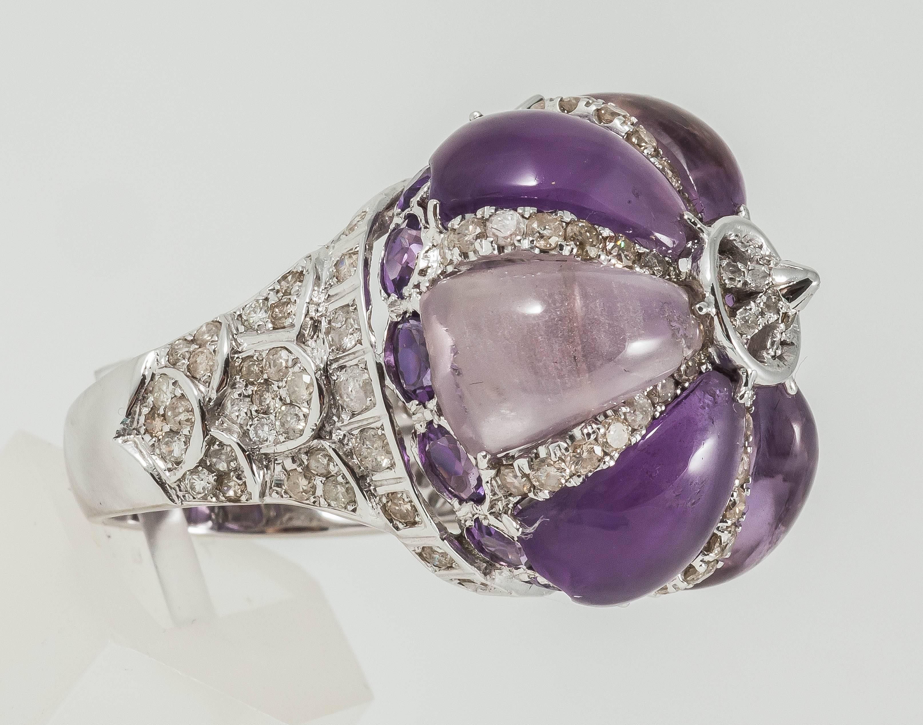 Dome inspired Ring adorned in Cabochon Amethyst & Diamonds

18K White Gold: 15.35gms
Diamond: 1.4cts
Amethyst: 82.4cts