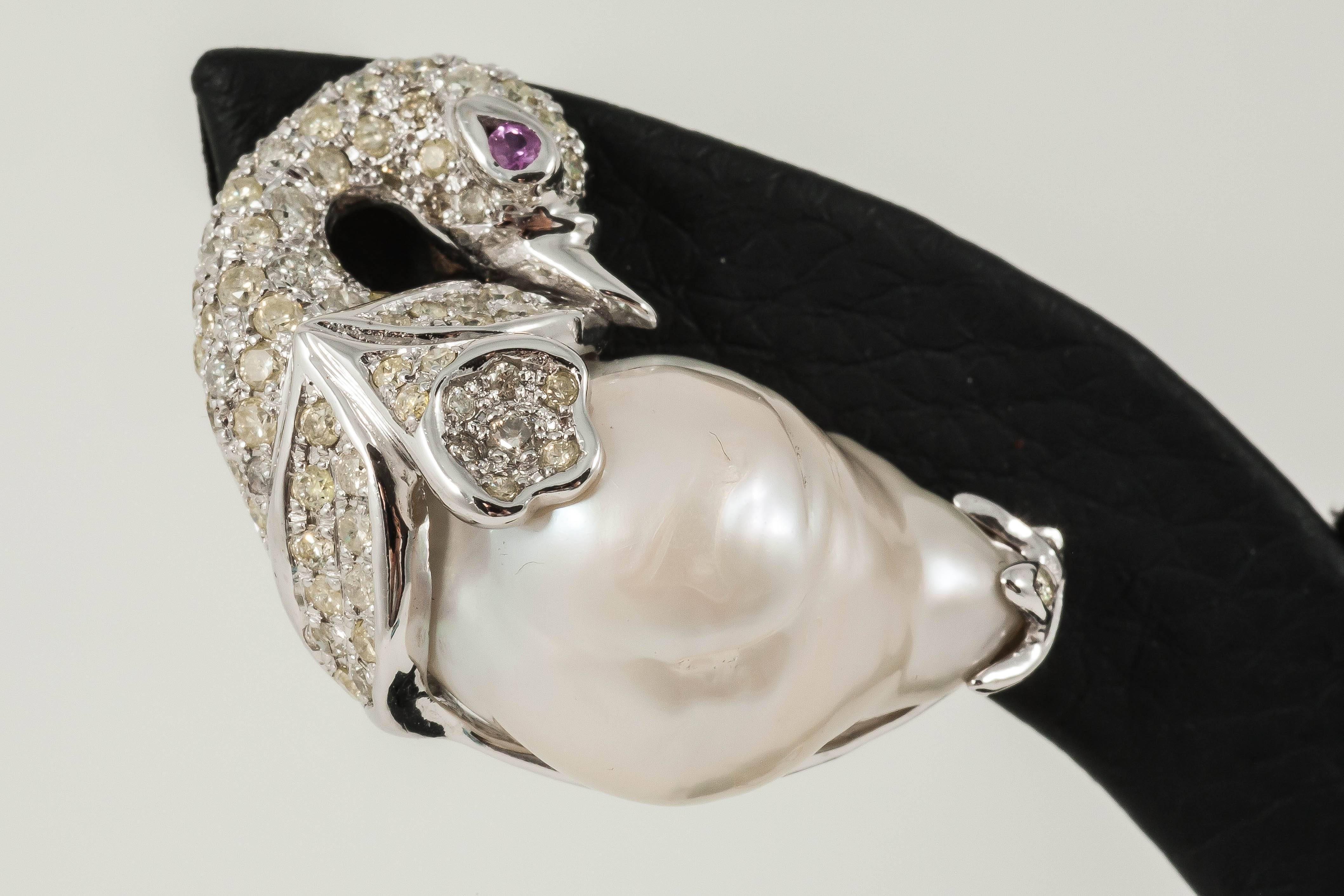 Diamond Swan studs

18K White Gold: 17.8gms
Diamond: 2.18cts
Baroque Pearl