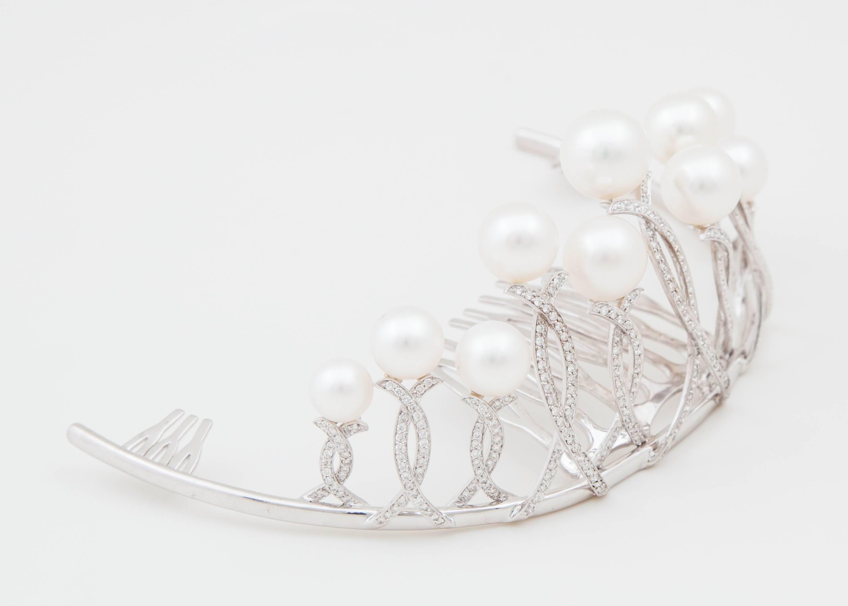 This natural color White South Sea cultured tiara is a must have to finish off a bridal or evening gown. The one of a kind tiara consists of 11 White South Sea pearls ranging in size from 8mm-12mm. It is set in 18k white gold with 2.3 carats of