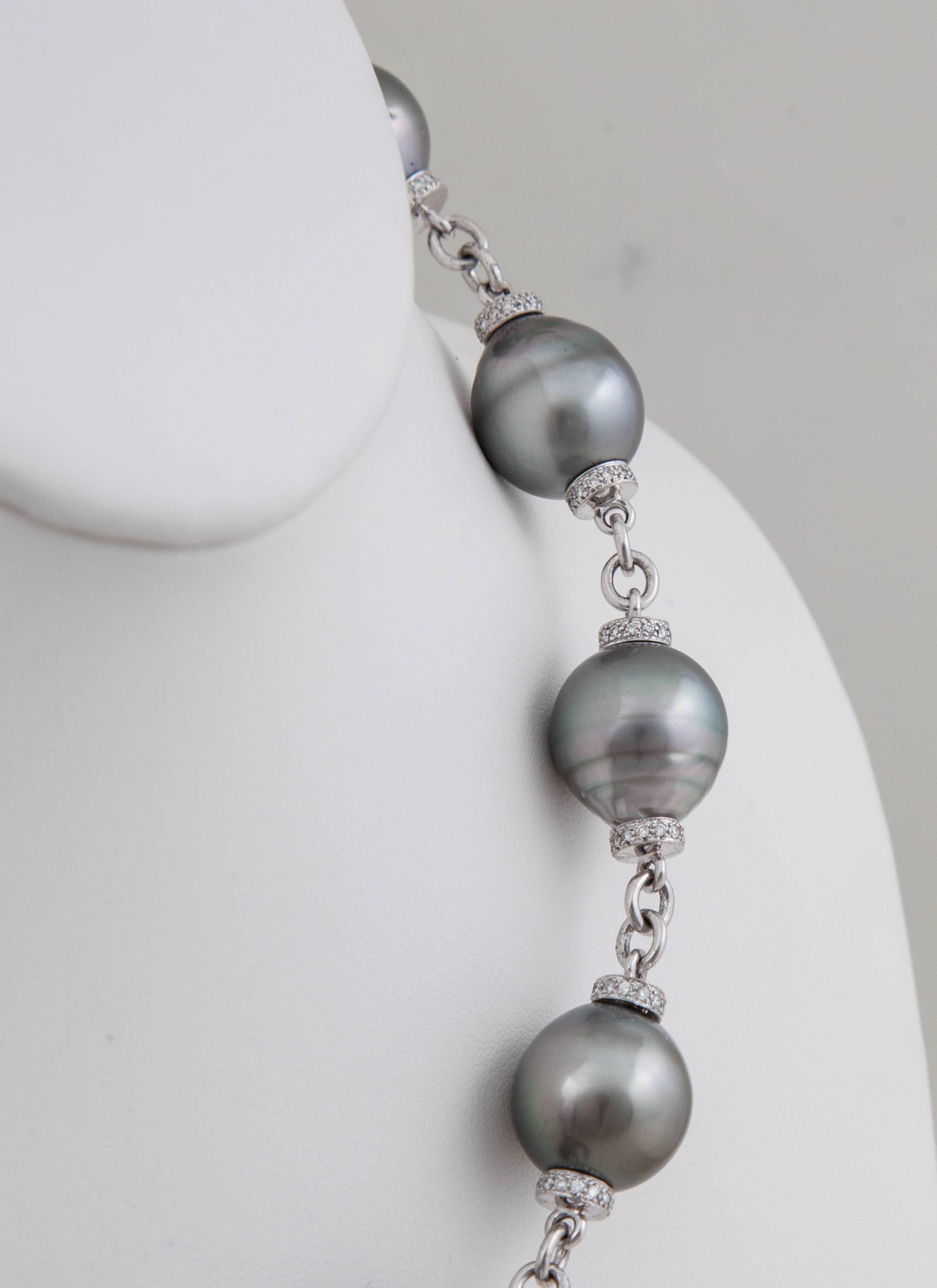 The 15x17mm natural color baroque Tahitian pearls on this bold necklace are surrounded by 2.66ct of understated diamonds. 

This necklace is 19.25