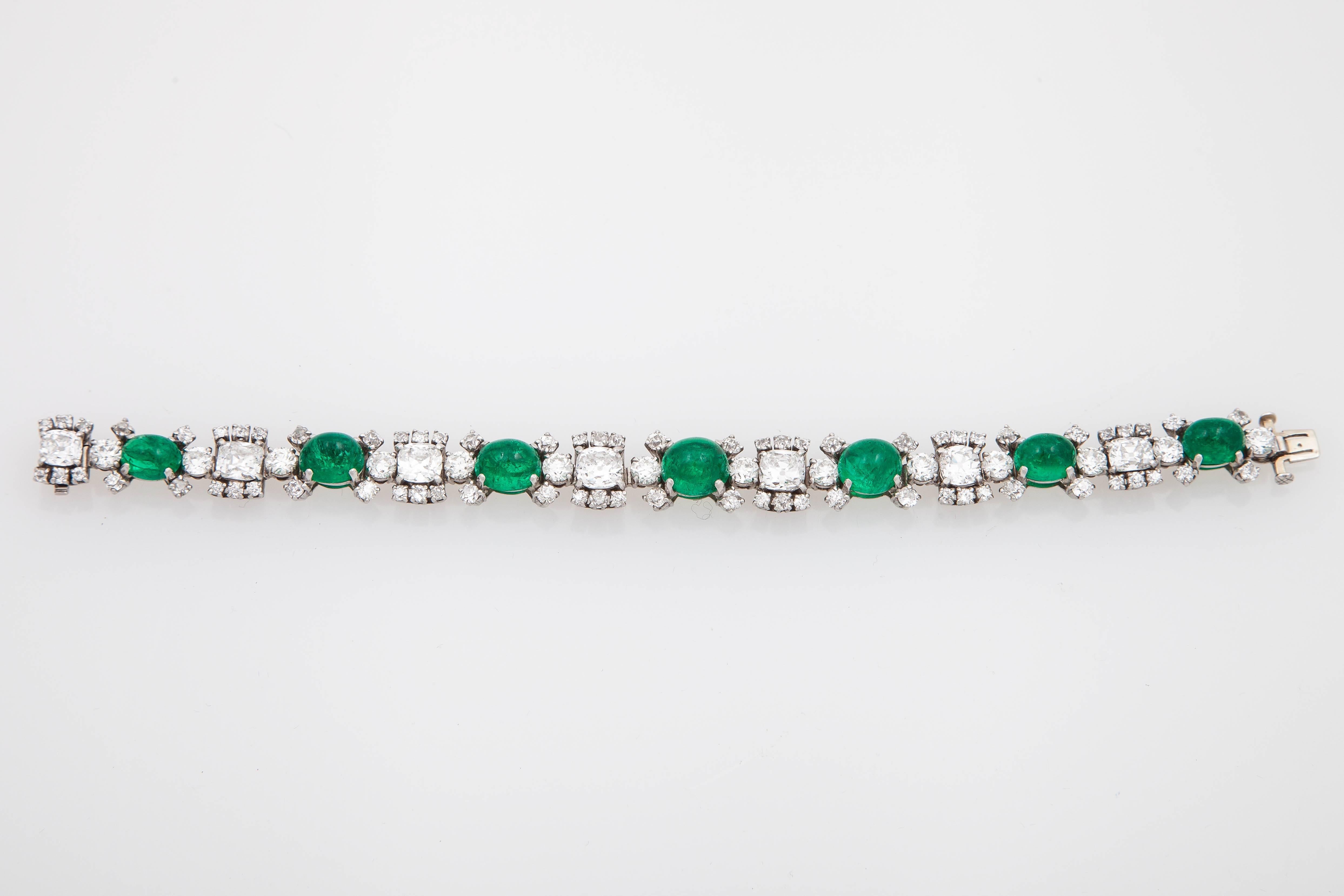 Elegant RAYMOND YARD designed as a series of graduated emerald weighing approx. 25.00 carats  with  brilliant cut diamonds weighing approx. 17.60 carats, mounted in platinum.