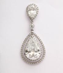 Regal Large Pear Shaped Diamond Dangling Earrings
