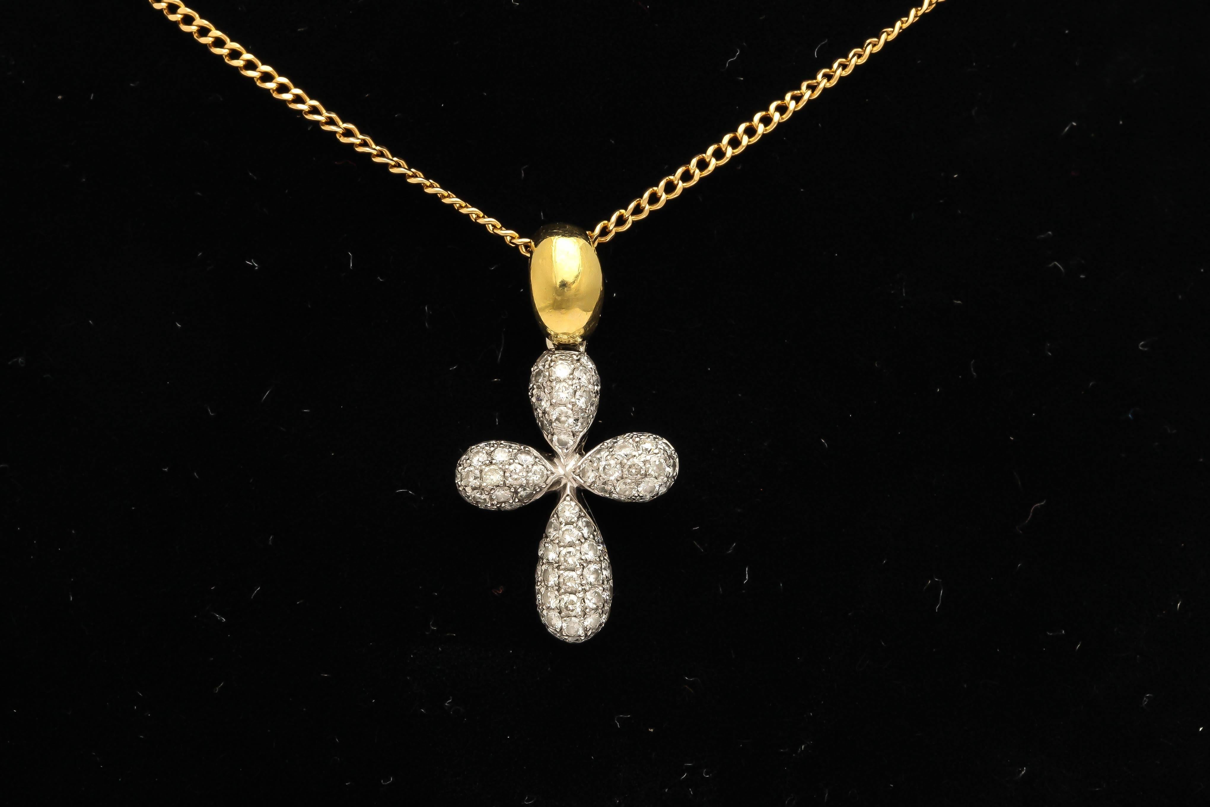 Of lobed design, the top pave-set with full-cut diamonds weighing approximately 1.23 carat mounted in white gold, attached to an 18k yellow gold bail and link chain. 

1/1/4 in. ((3.2 cm.) long including bail; the chain: 18 in. (45.7 cm.) long.