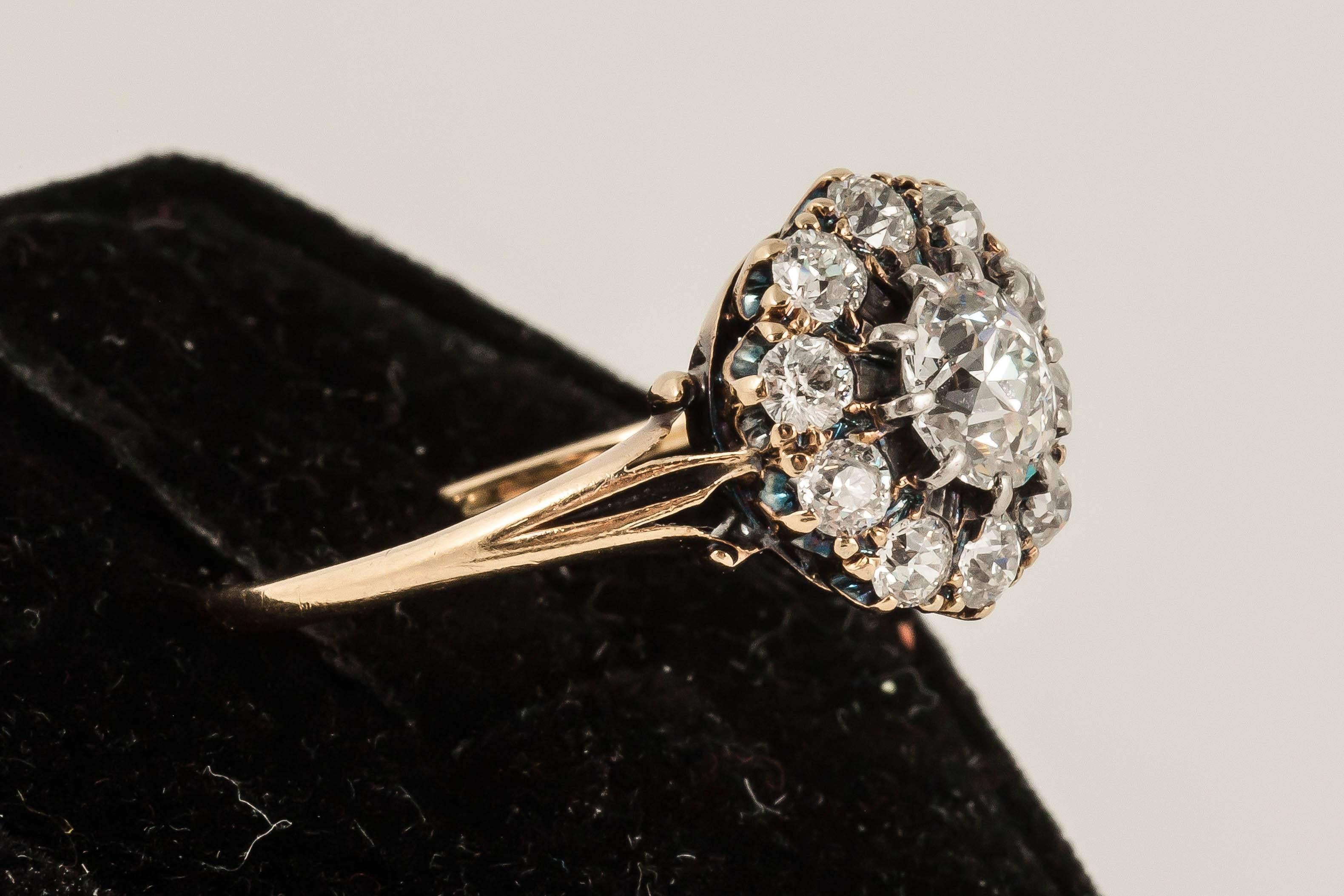 This old cut Diamond ring consists of centre stone .90 ct surrounded by another carat of Diamonds