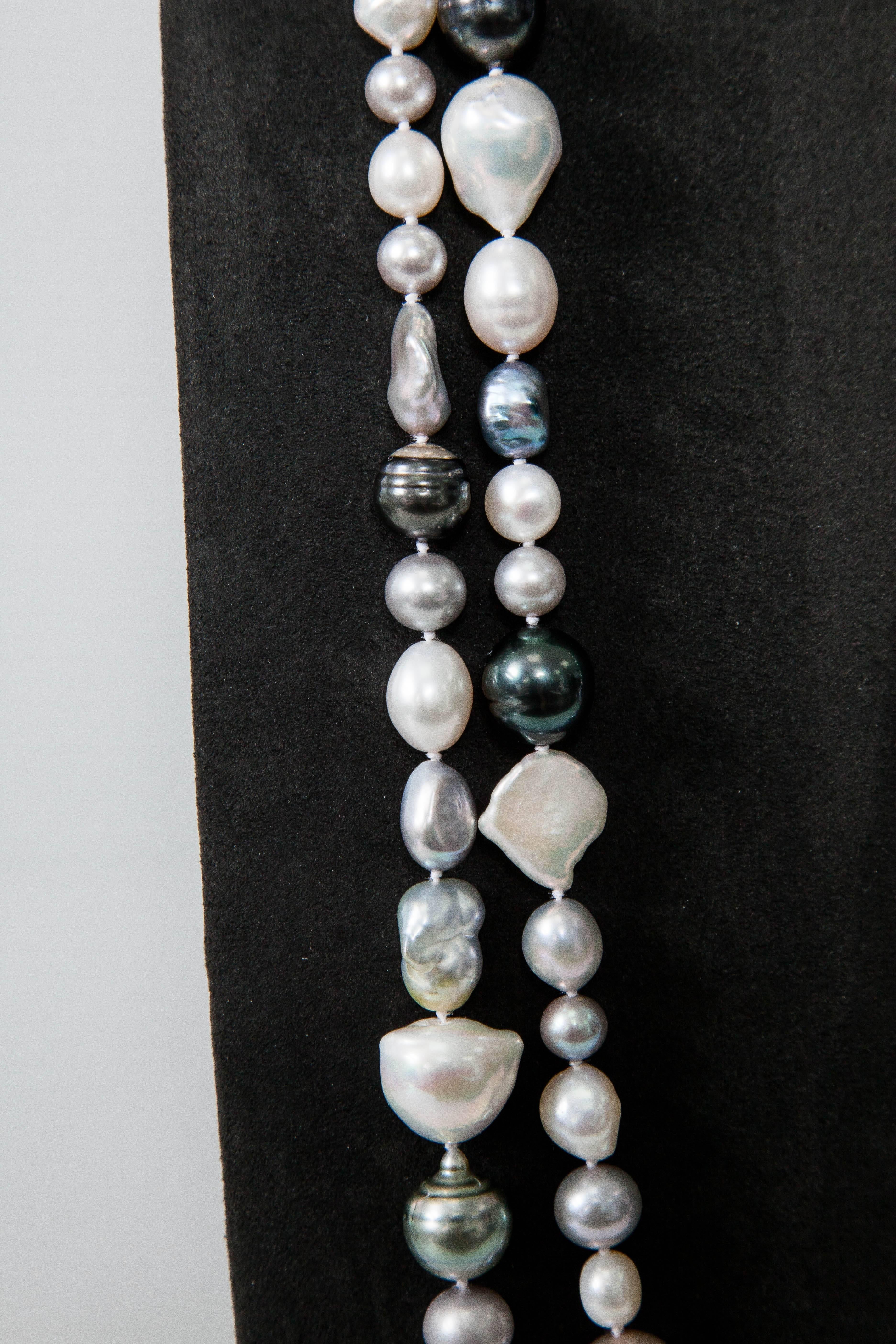 This fun,classy necklace features a mixture of Tahitian,Freshwater and South Sea Pearls.The length of the necklace is 72 "
The pearl size is between 7mm to 15mm White and black grey tones all shapes.