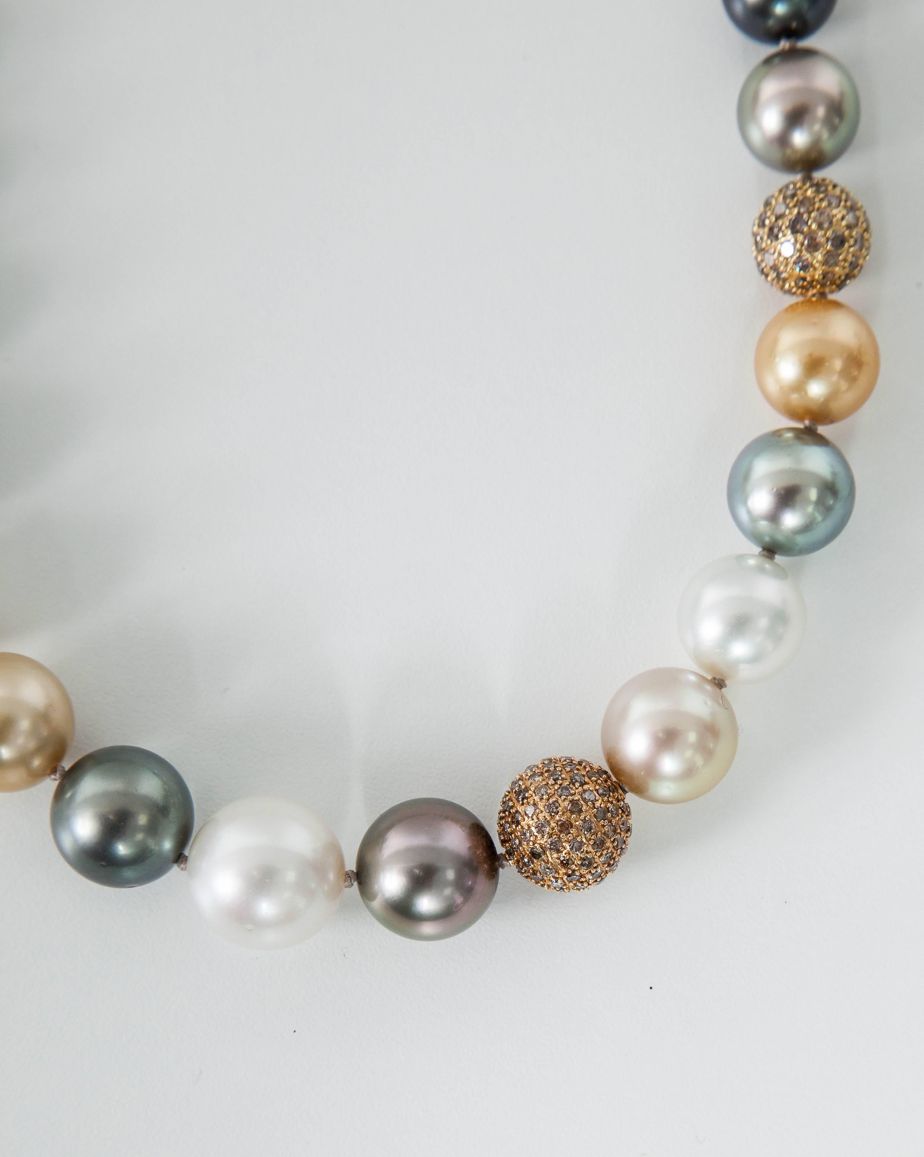 This amazing Necklace feature:
South Sea Cultured Multi color Necklace approximate size 10.5mm to 14.5mm
Pearl Count: 32pcs.
Pearl Quality: AA
Pearl Luster: AA
Diamond Balls: 7 cts
The Origin of the pearls are: Australia,Indonesia,Tahiti