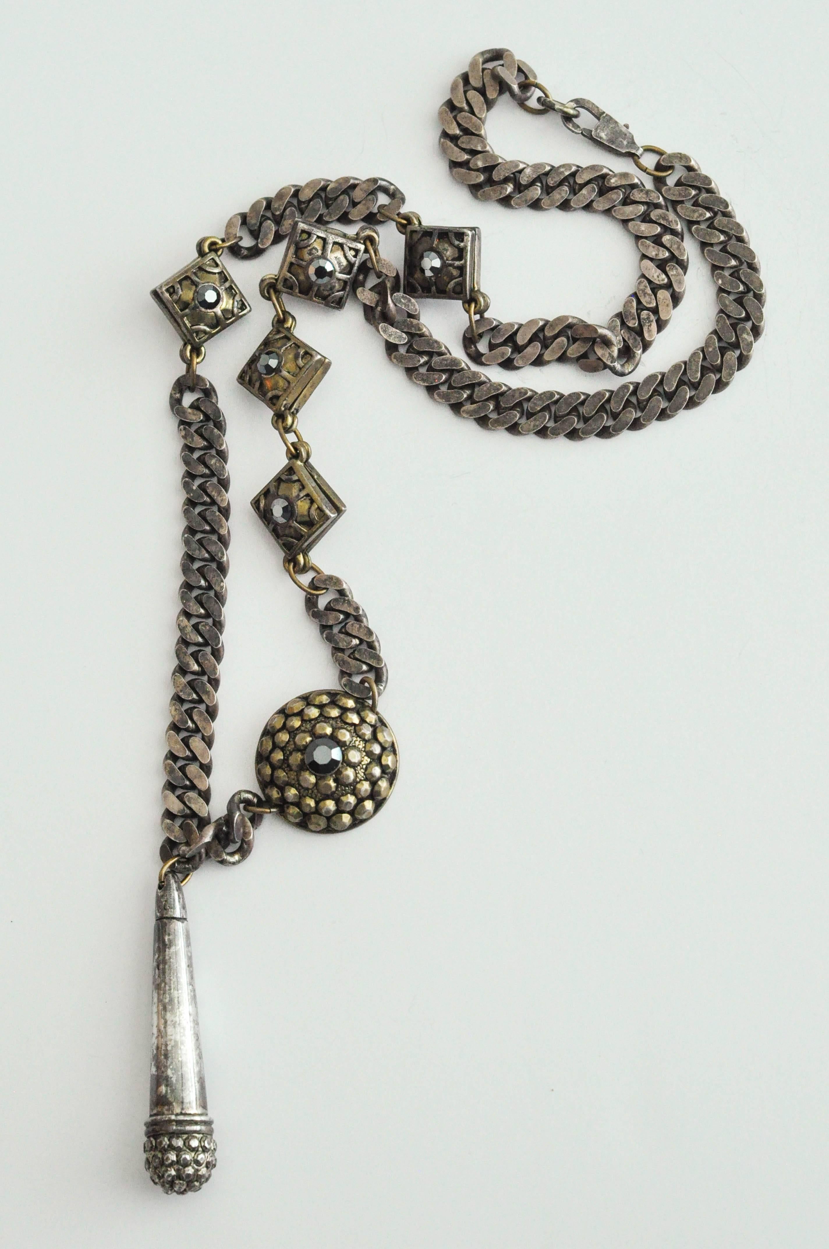 An early, silver and bronze -tone chain necklace by French couture designer Jean Paul Gaultier (b. 1952).  Known as the enfant terrible of French fashion, Gaultier's designs were brilliantly irreverent, drawing upon street culture.  This very, very