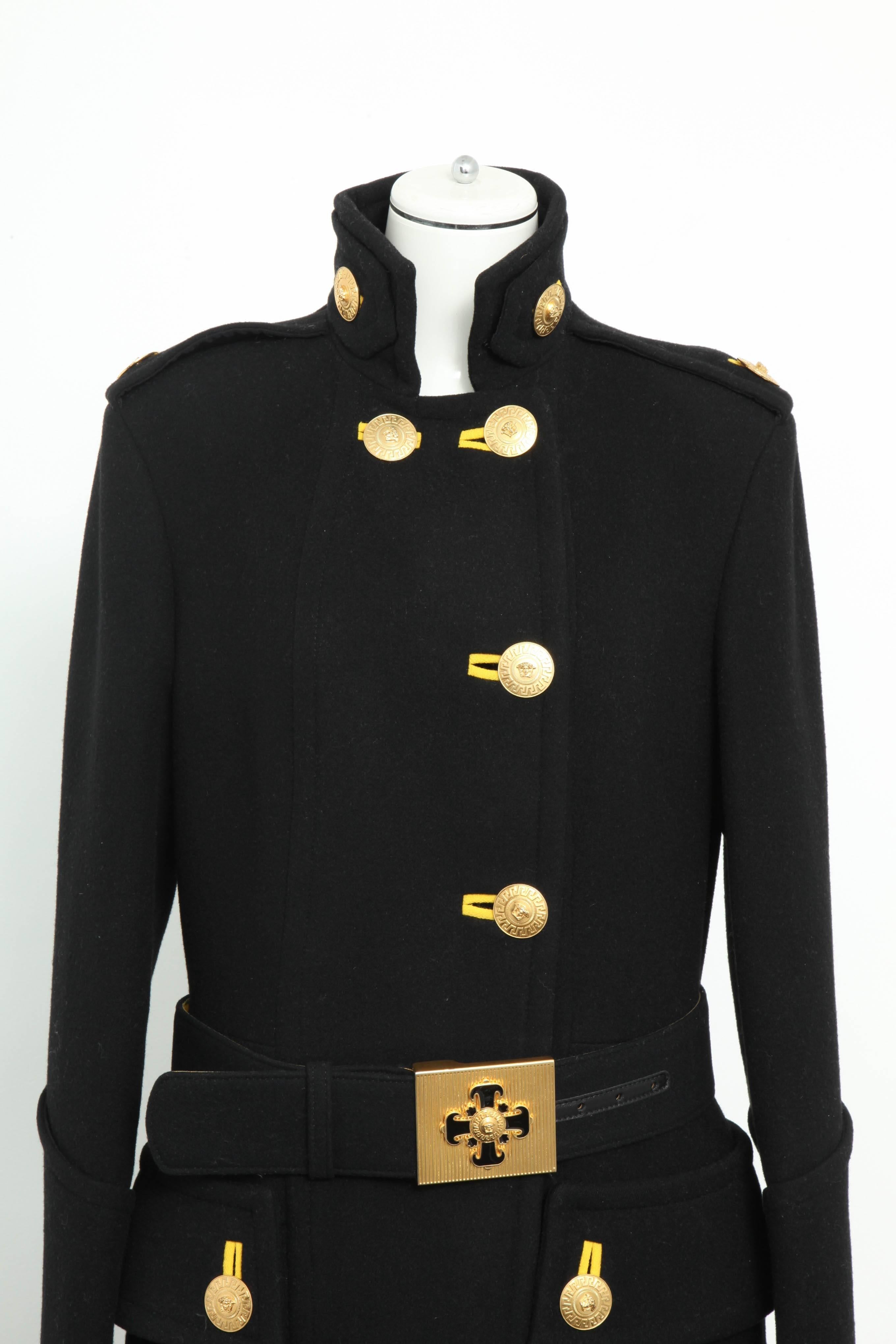 From one of Donatella Versace's best collections, beautiful black wool coat with Medusa buttons and a belt. A runway piece. Size is IT 44 but fits slightly small, about US 4-6.