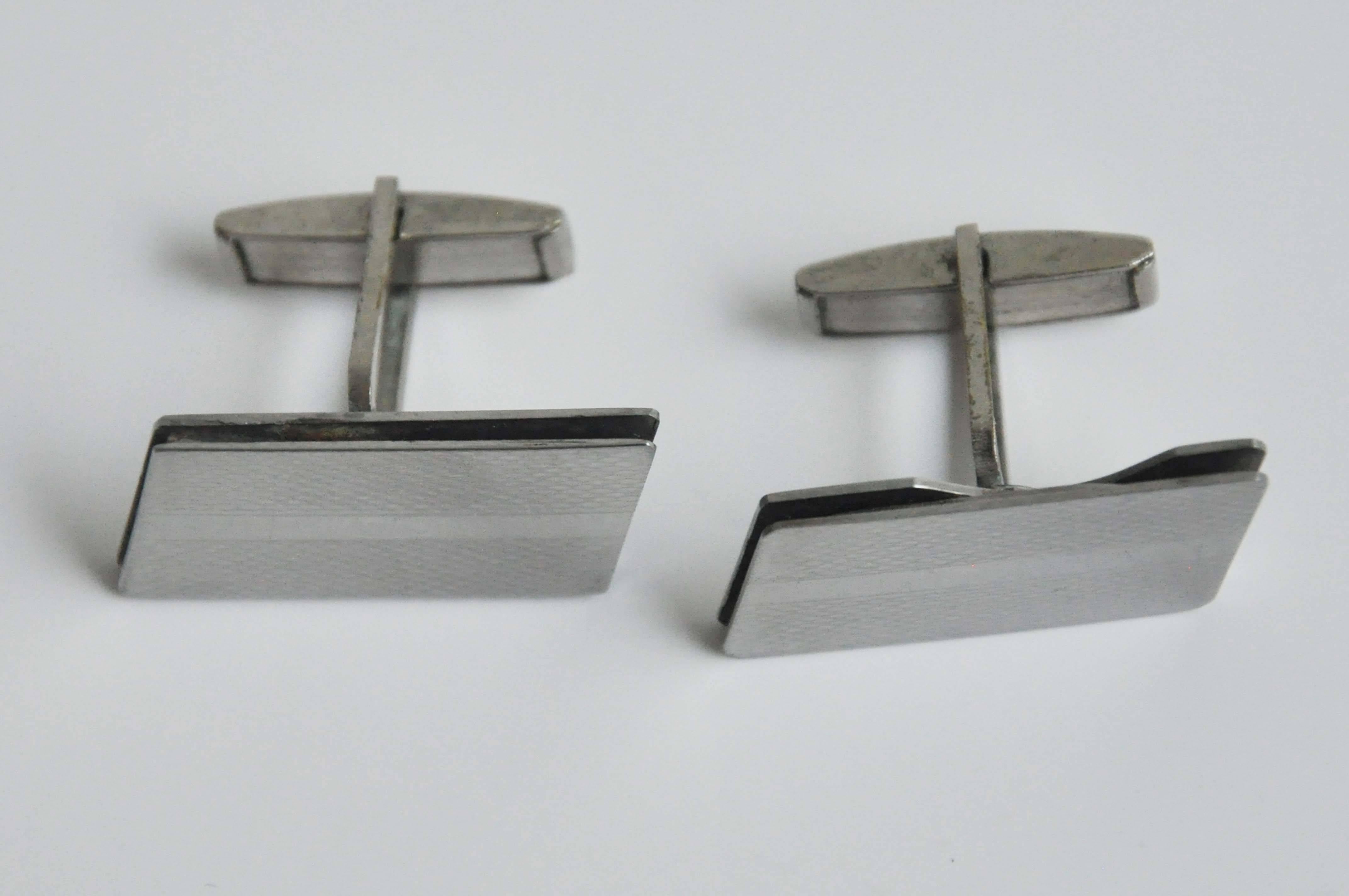 A pair of metal cufflinks from Italy reminiscent of the 70s 