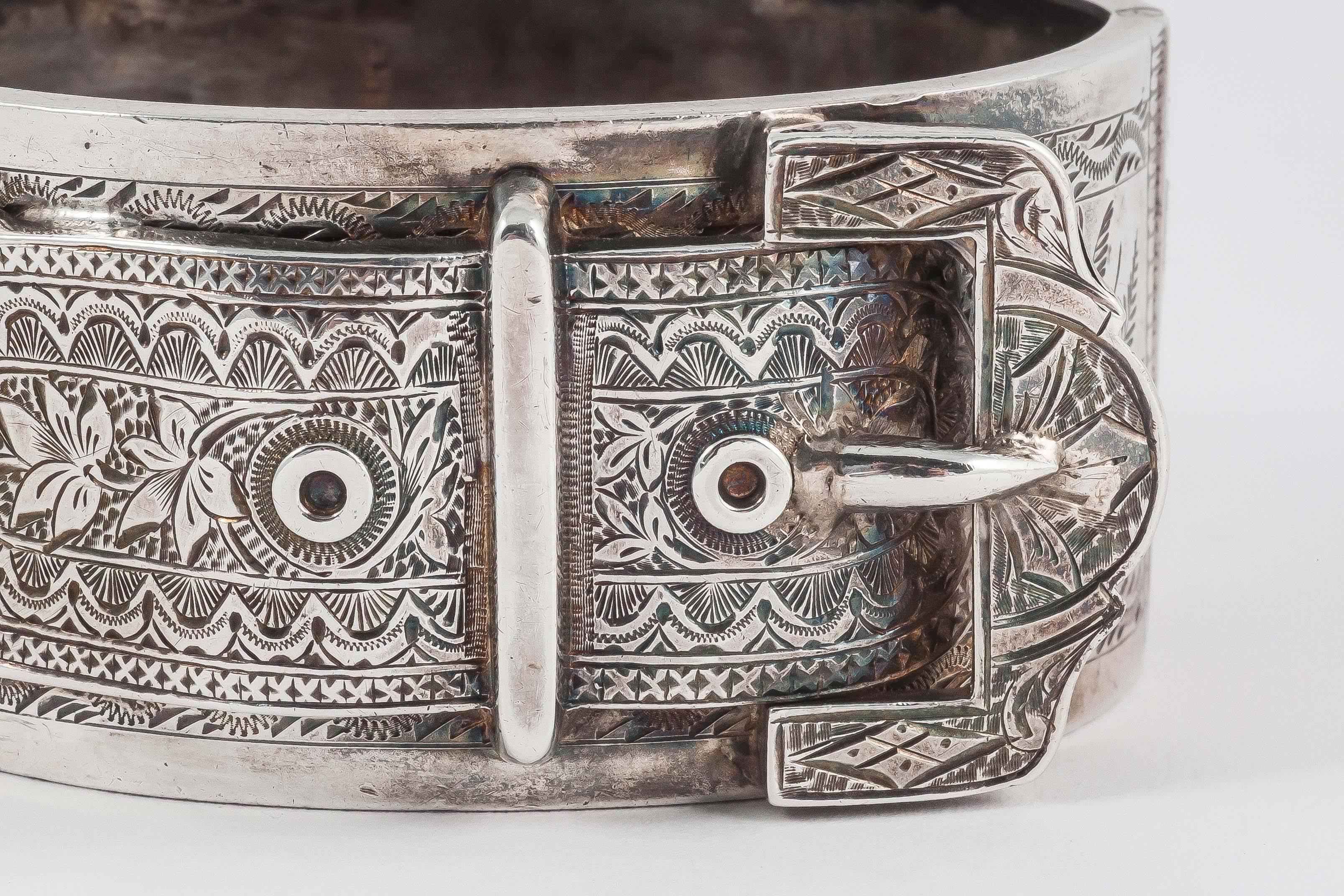This super cuff is hallmarked, but they are tiny so all I can see is the lion that denotes it is English sterling silver. This is a bold and timeless design that looks unexpectedly modern but has the charm of floral engraving on the buckle and