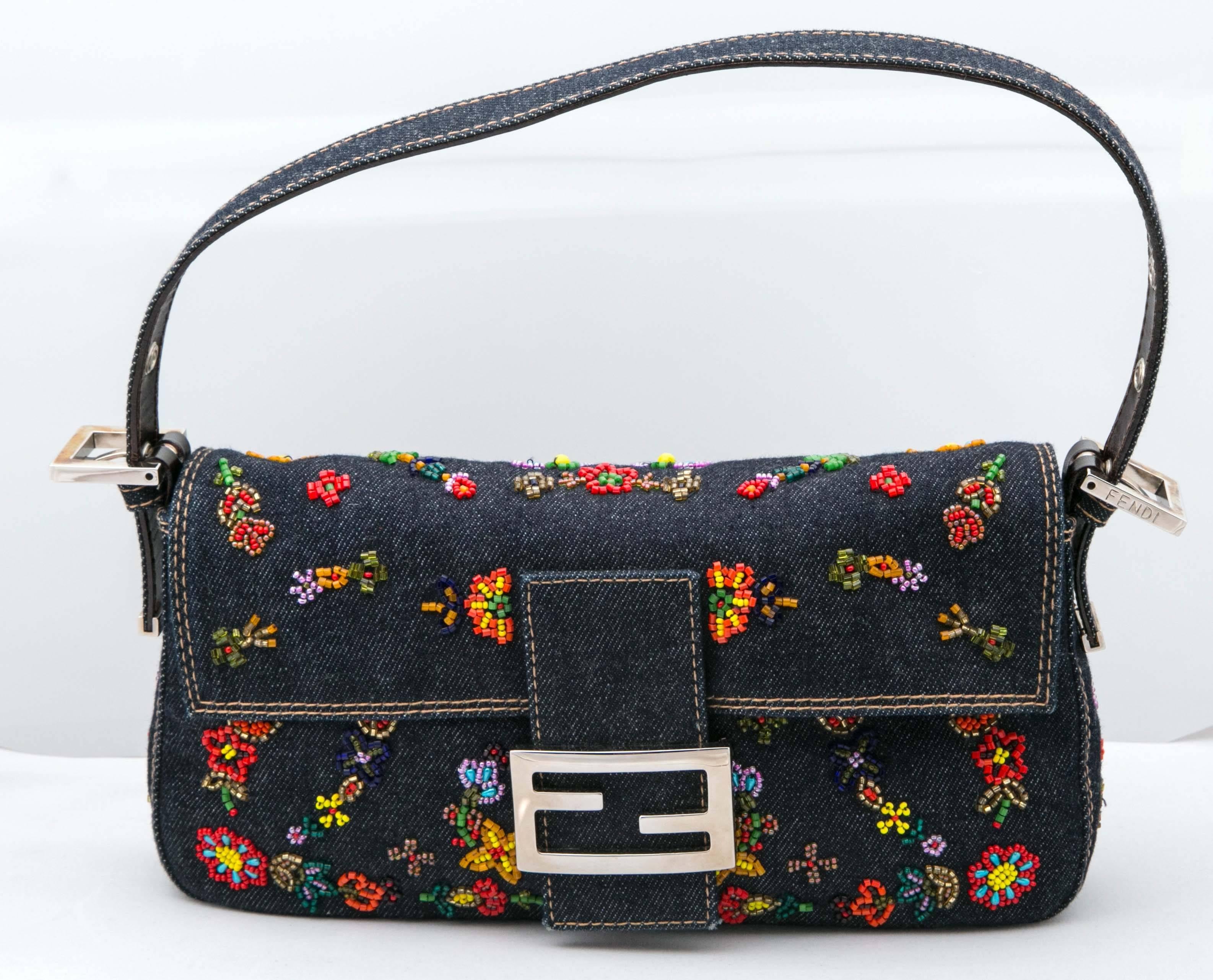 Mint condition purse with beaded floral motif on denim with chrome hardware.  Hardly worn with original dust bag. 