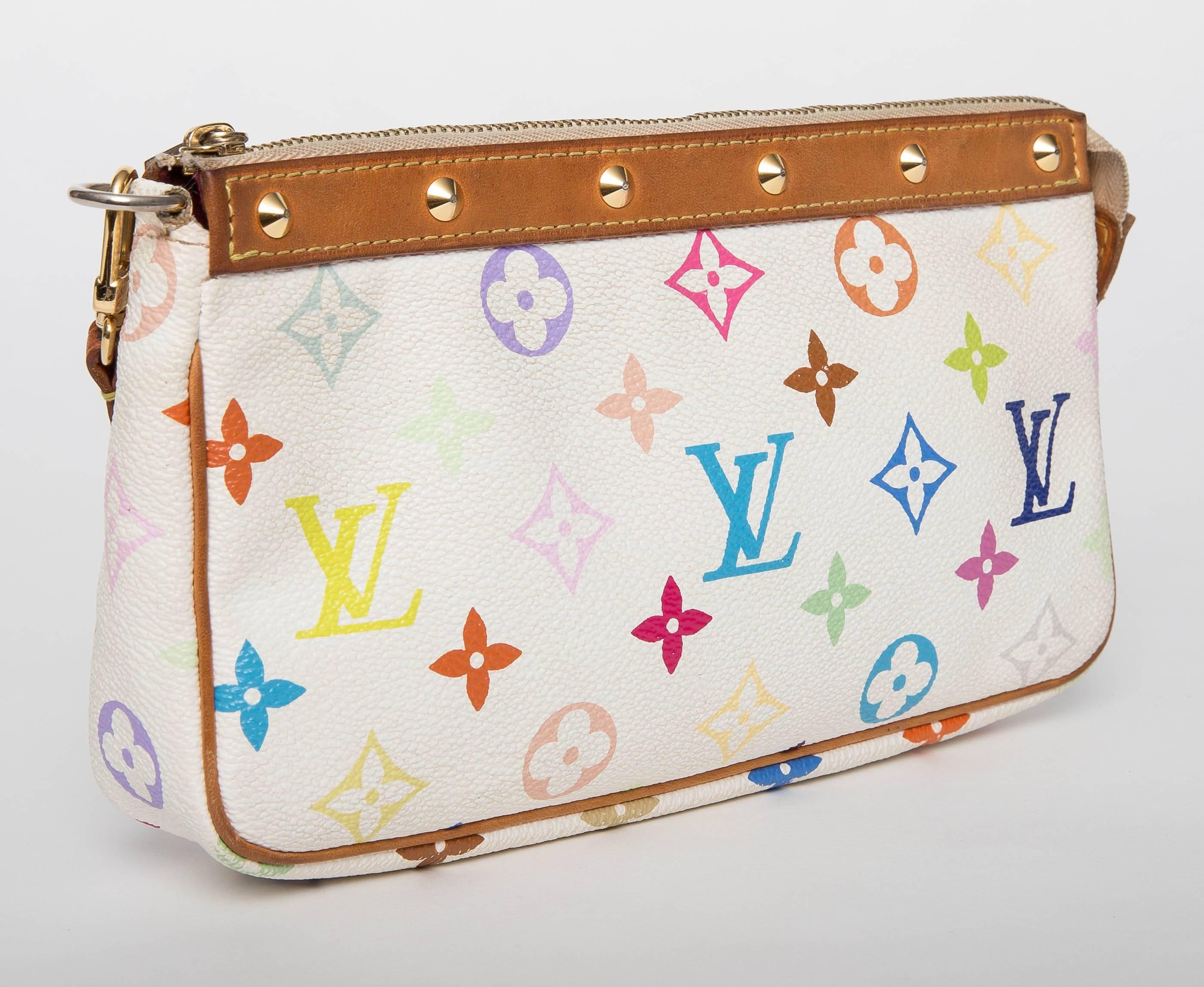 Louis Vuitton Murakami Multicolore Studded Pochette Handle Bag feautures single zip closure with metal zipper pull ,removable flat studded leather handle,and goldtone hardware.

Comes with original dustbag.

