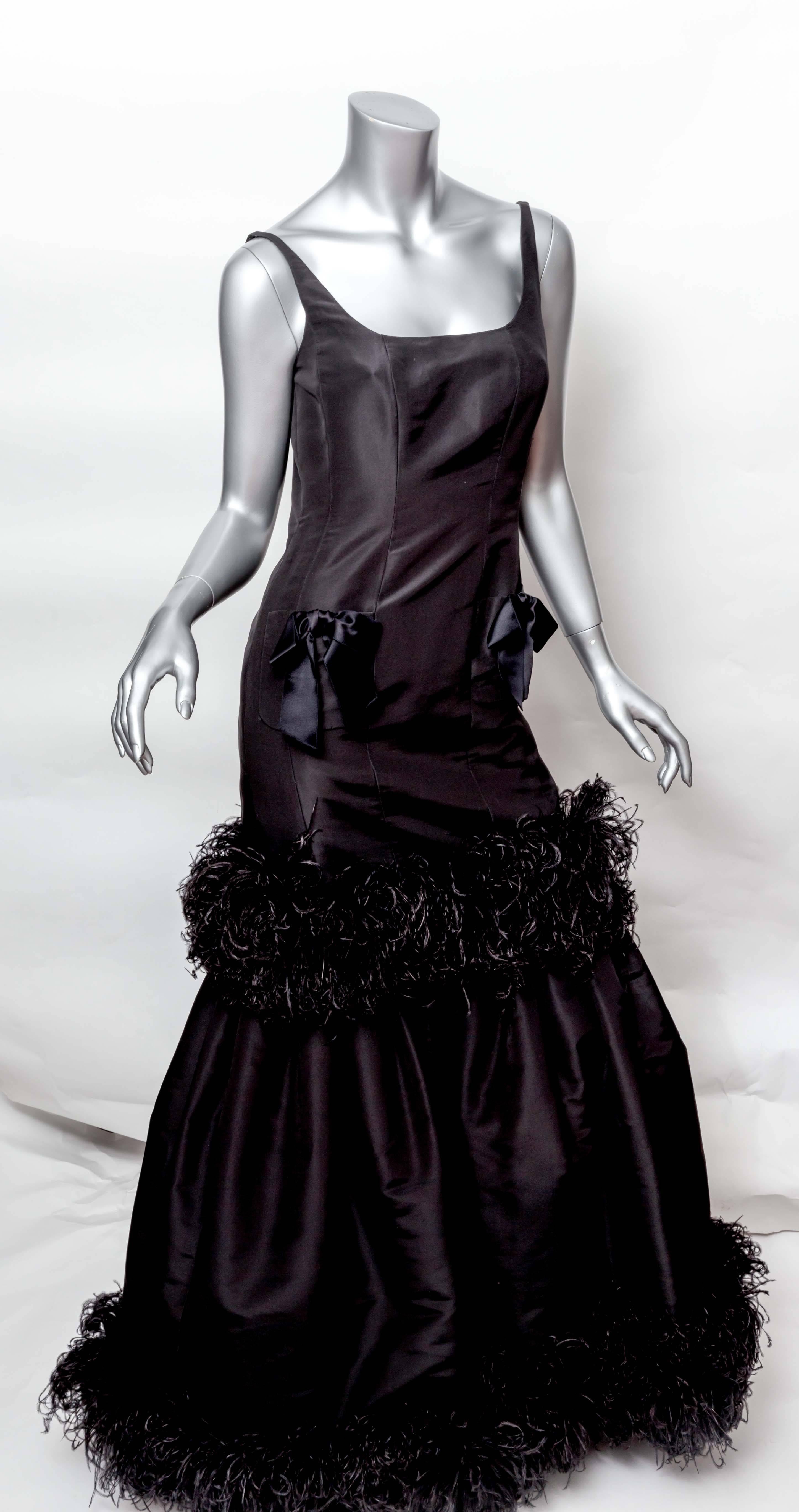Black Silk Taffeta Ostrich Feather Evening Gown with Black Satin Bows. The Mermaid Silhouette is wonderfully flattering. 