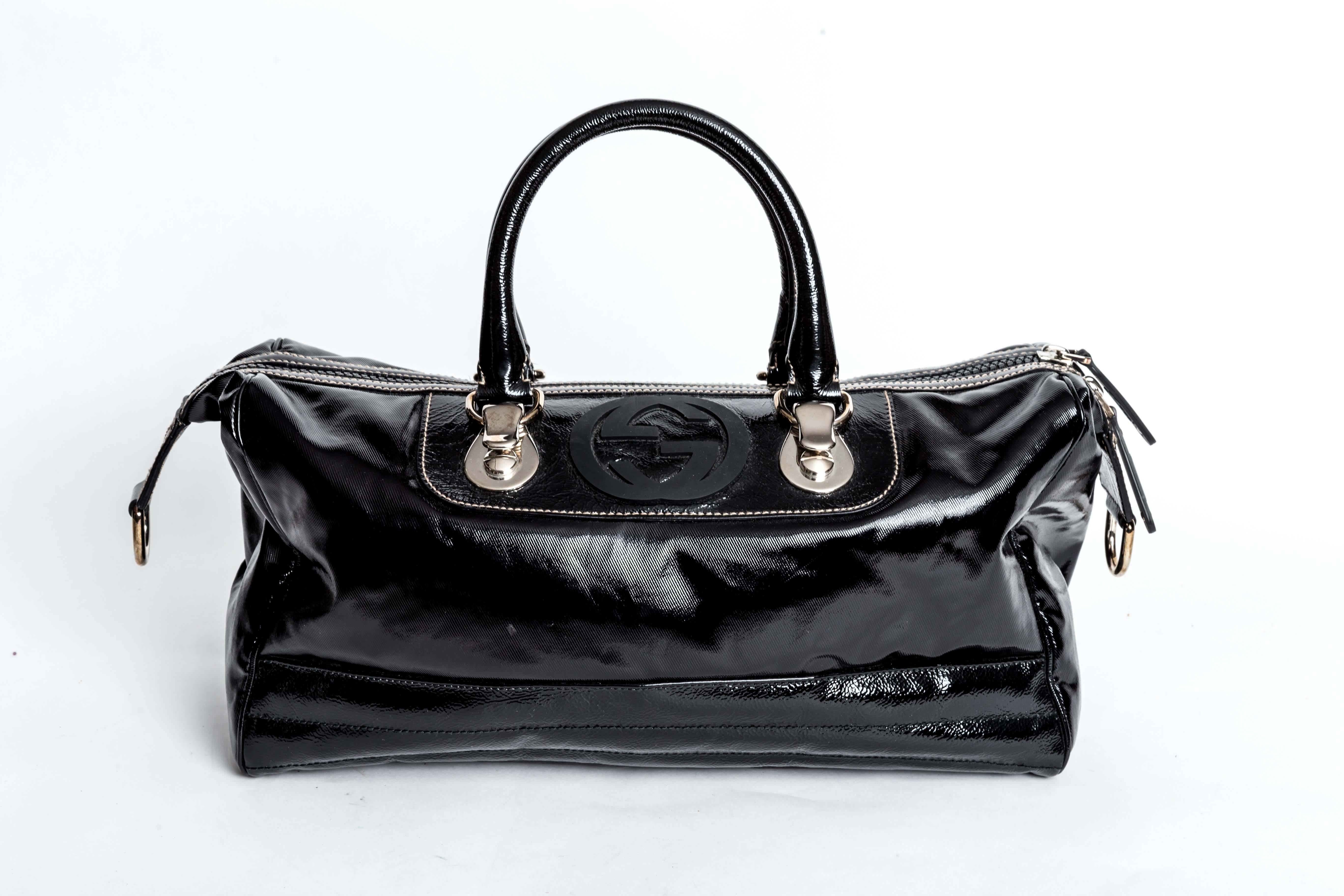 Gucci Black Snow Glam Limited Edition Leather Satchel with Silver Hardware. Five metal feet to bottom of bag. Both interior and exterior condition are excellent. 
Handle drop is 5.5 inches.