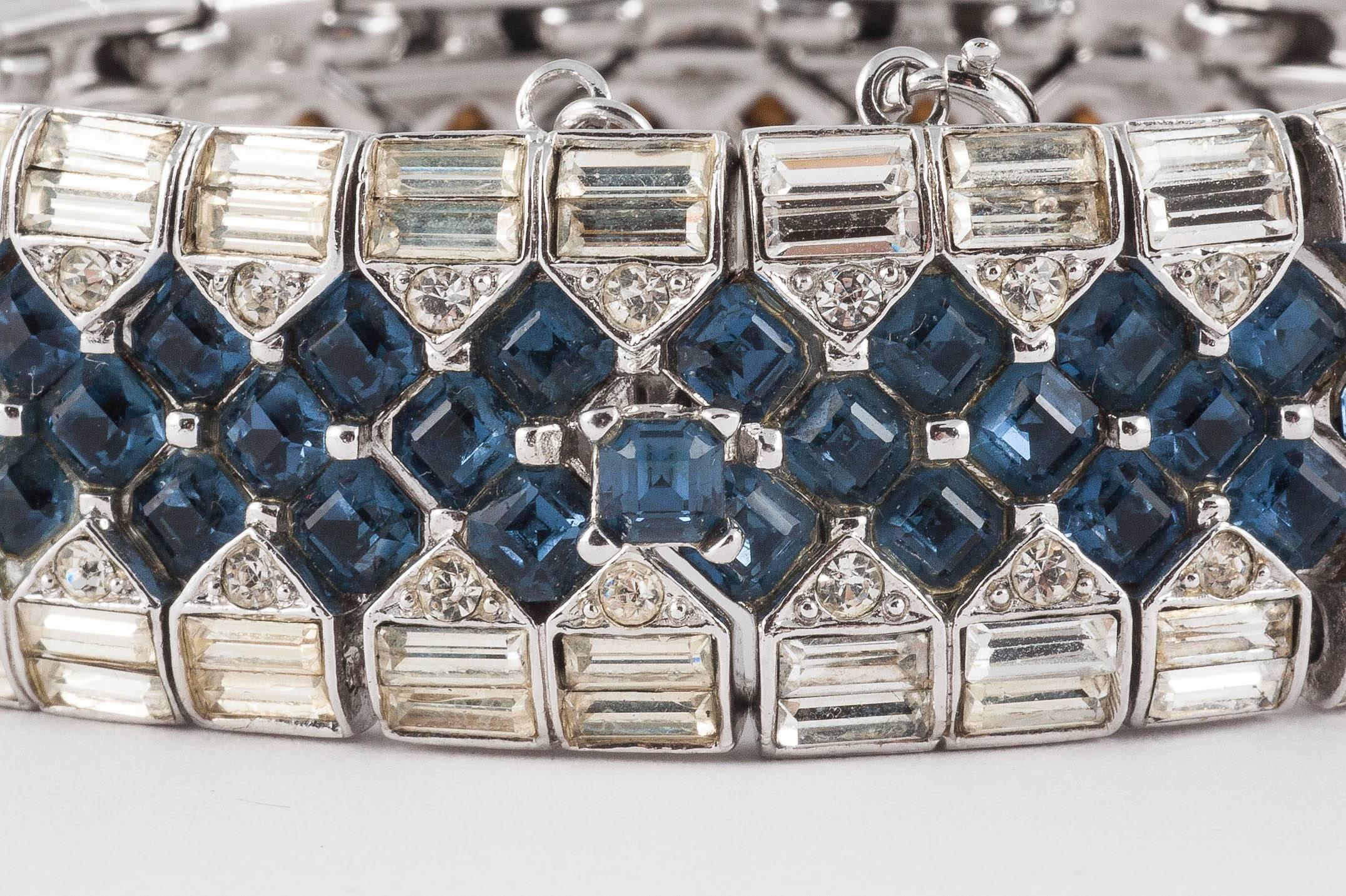 Exquisite pave set bracelet, with sapphire square paste, lined with clear paste baguettes, creating a look as if the bracelet is pulling back to reveal the square cuts beneath. The pastes are set in rhodium plated metal, with a safety chain option