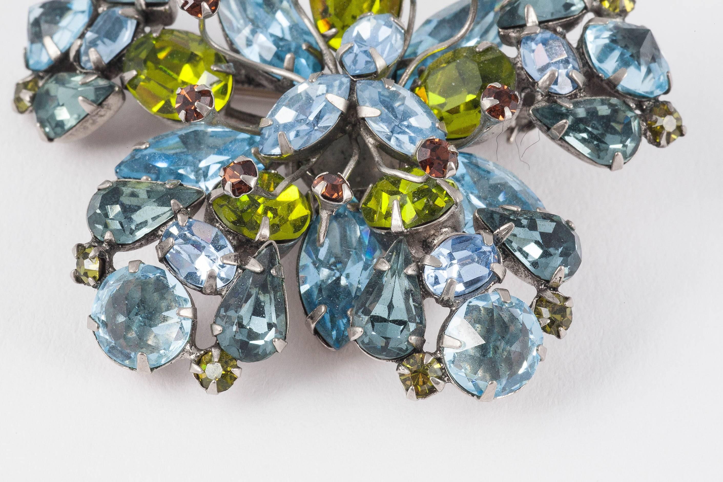 The reason we all love Henry Schreiner is his incredible colour combinations. The wonderful Peridot coloured Austrian crystal, the inverted blue crystals and his use of many different shapes in one piece always create excitement. Then the addition