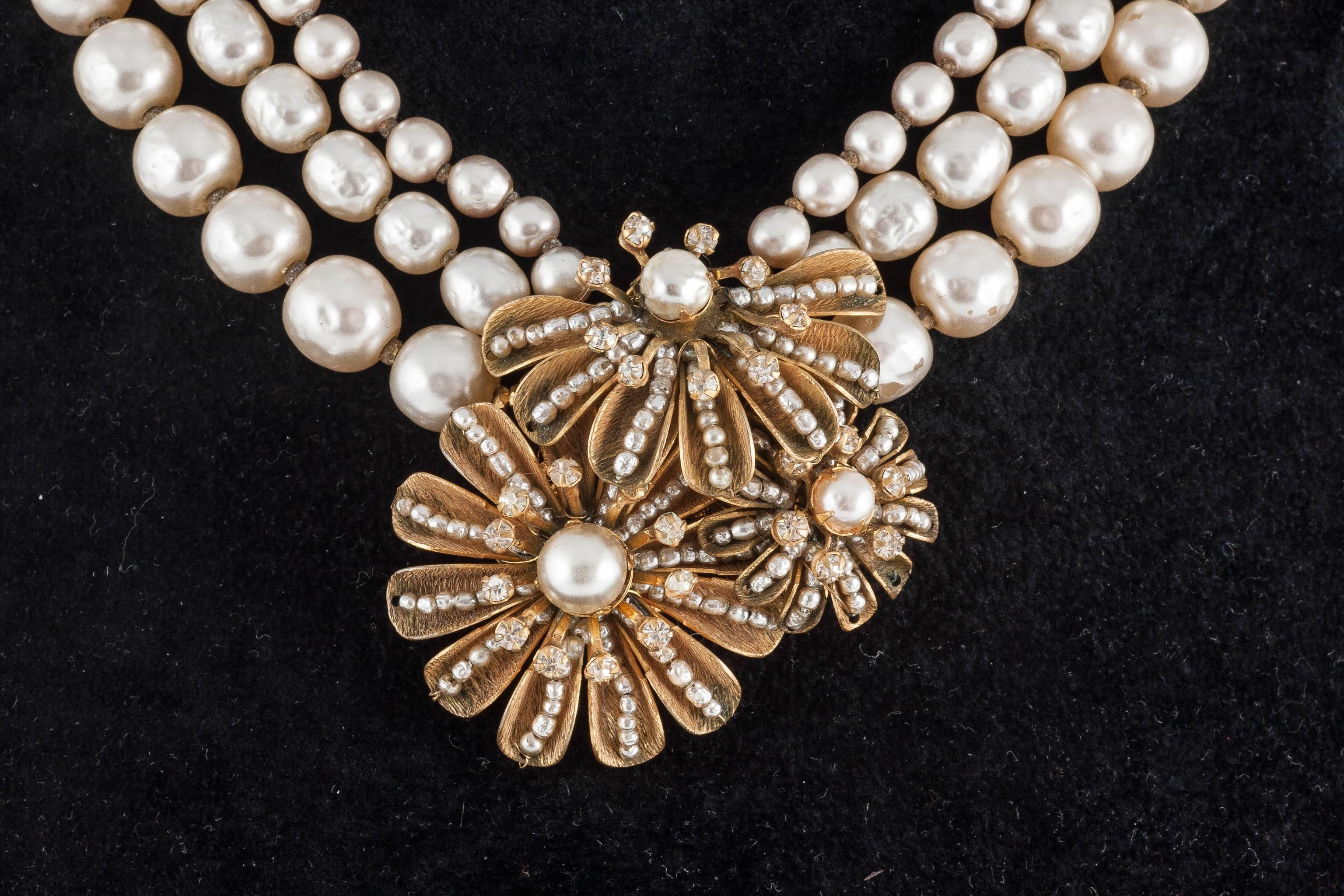Splendid Miriam Haskell baroque pearl three row necklace, with an opulent gilt, seed pearl and paste centrepiece. Beautiful work is displayed as always in the centrepiece, with a variable baroque pearl 'chain' at the rear to allow for variation in